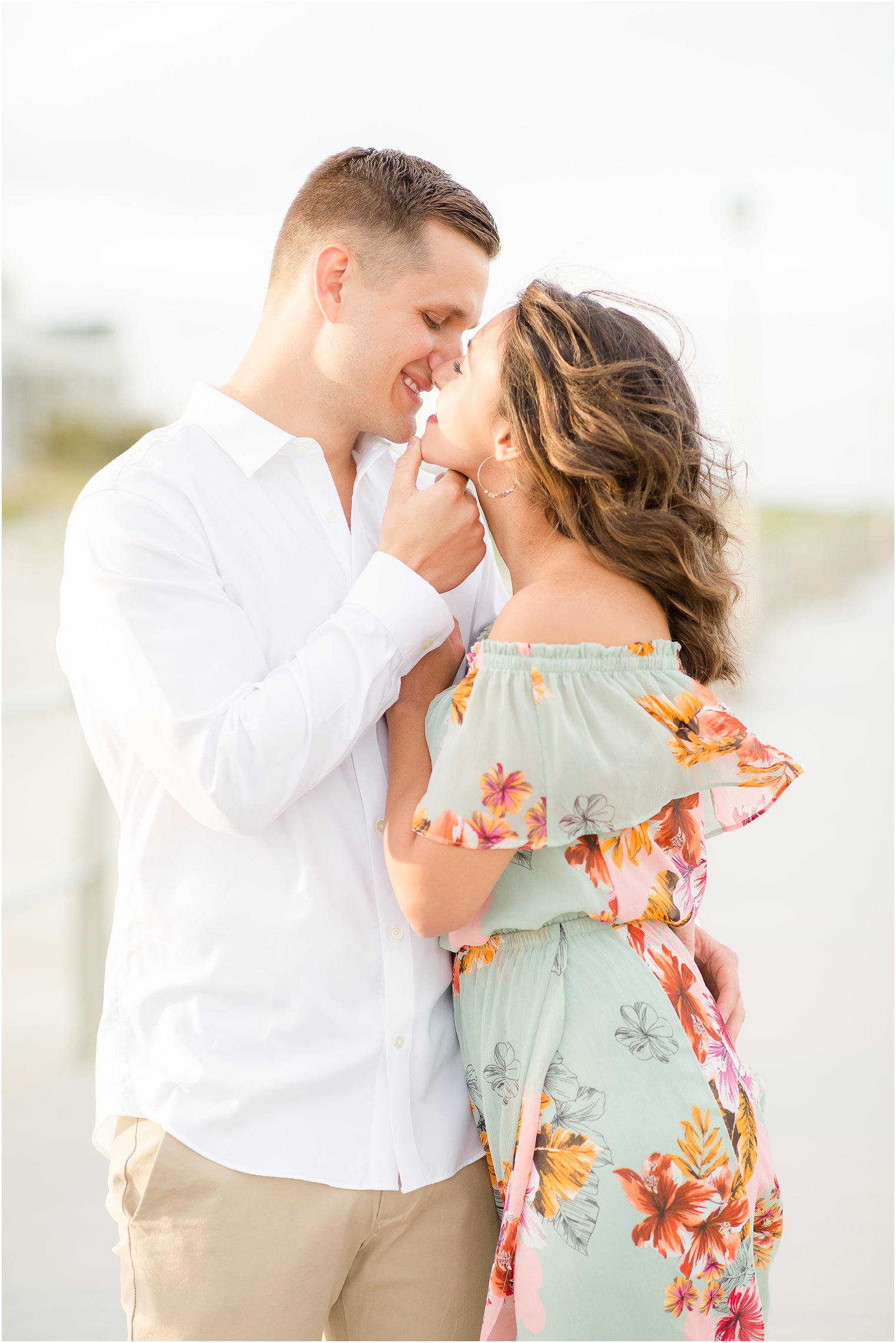 Engagement photos on the boardwalk by Spring Lake Wedding Photographer