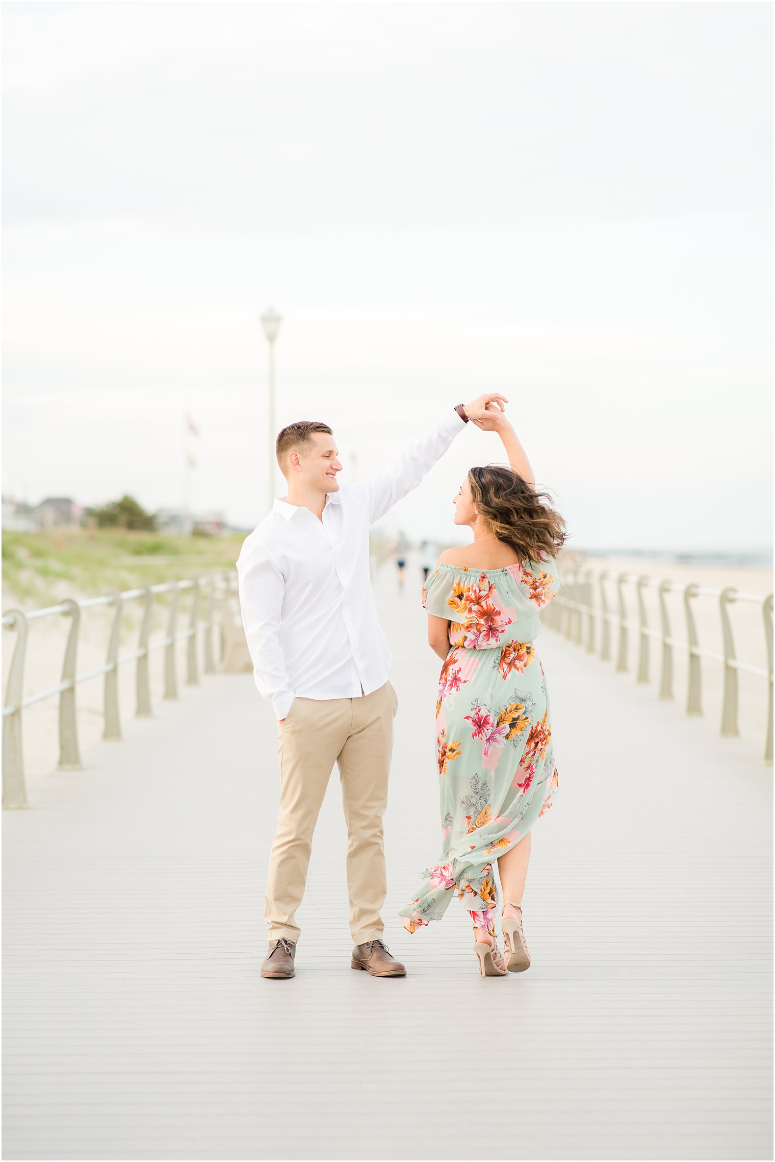 Engagement photos on the boardwalk by Spring Lake Wedding Photographer