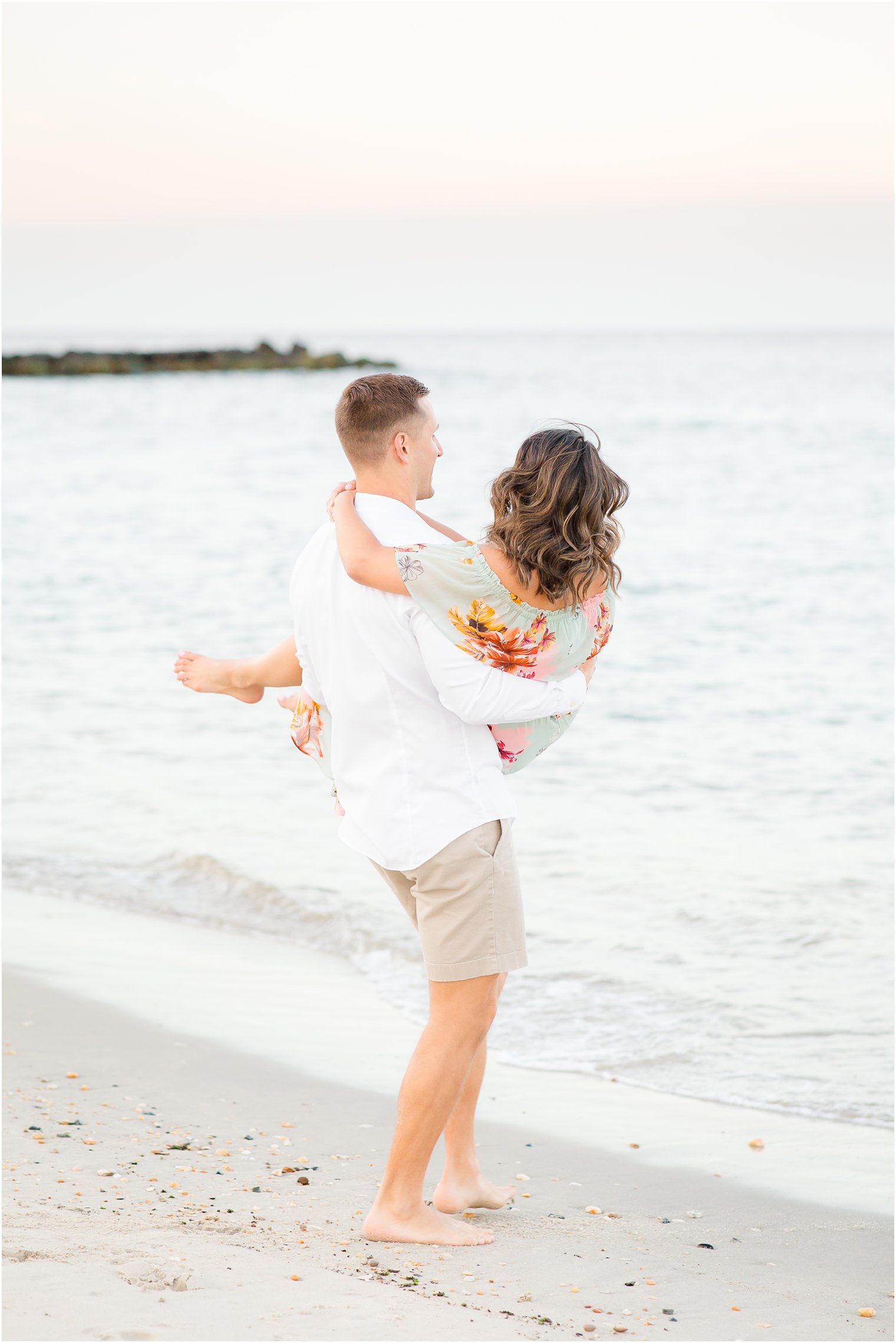 Engagement photos on the beach by Spring Lake Wedding Photographer