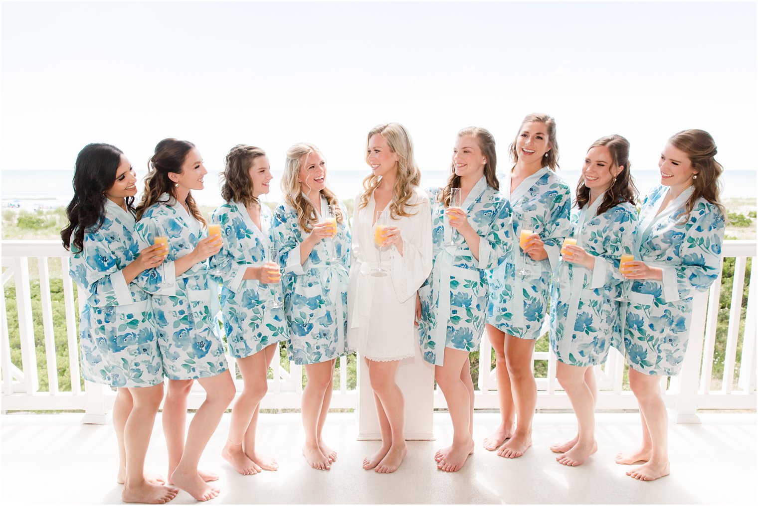 Bridesmaids toasting with views of the ocean at ICONA Avalon