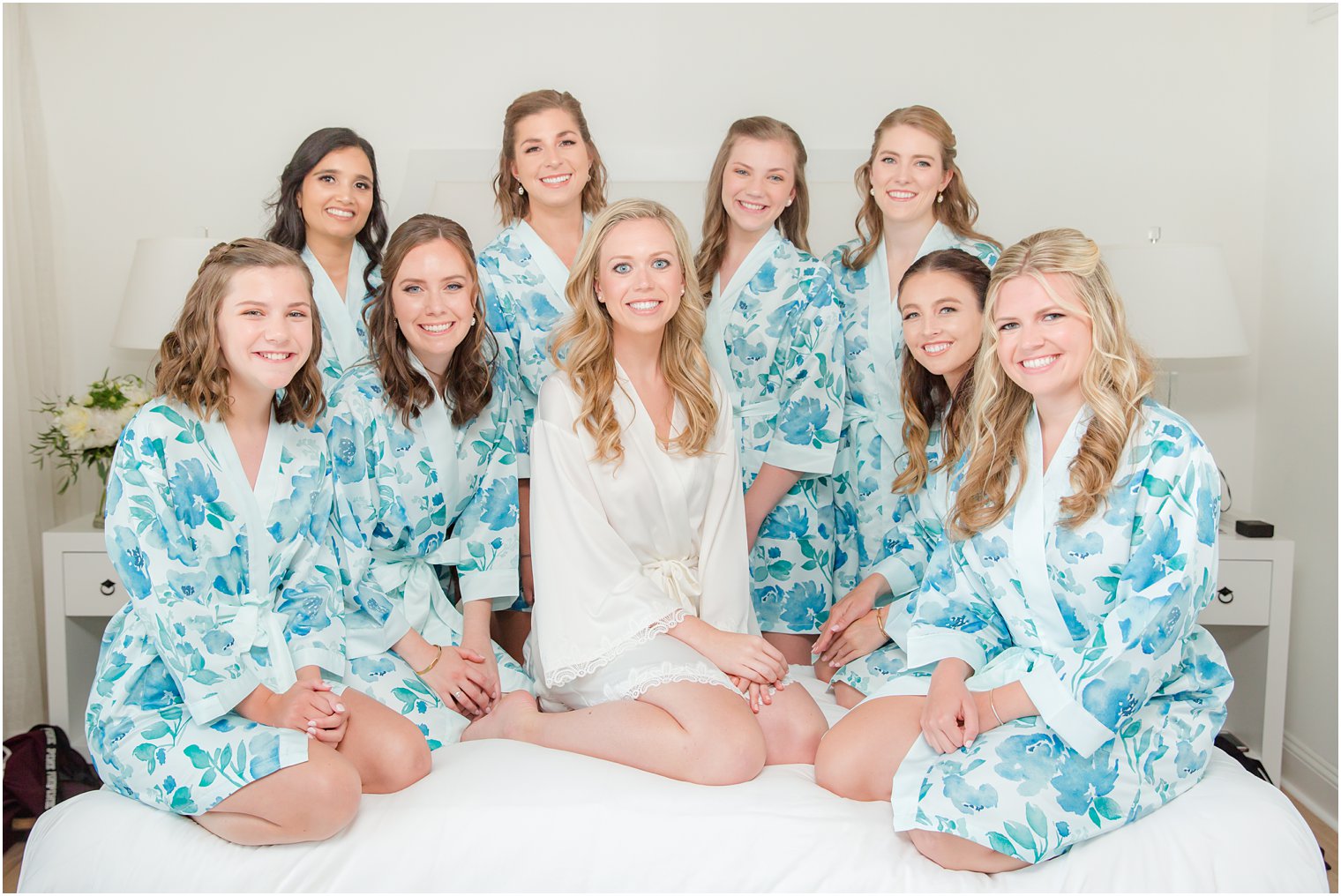 Bridesmaids wearing blue floral robes