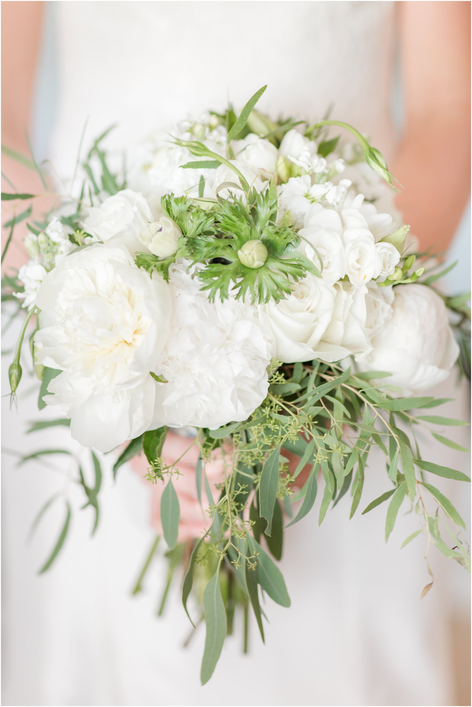 Florals by Blooms | Bride getting ready at ICONA Beach Resort