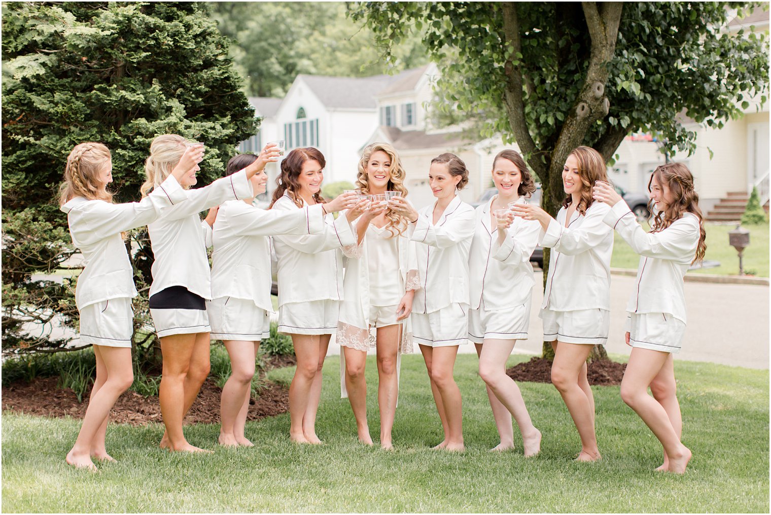 bridesmaids toasting in their robes at Indian Trail Club Wedding