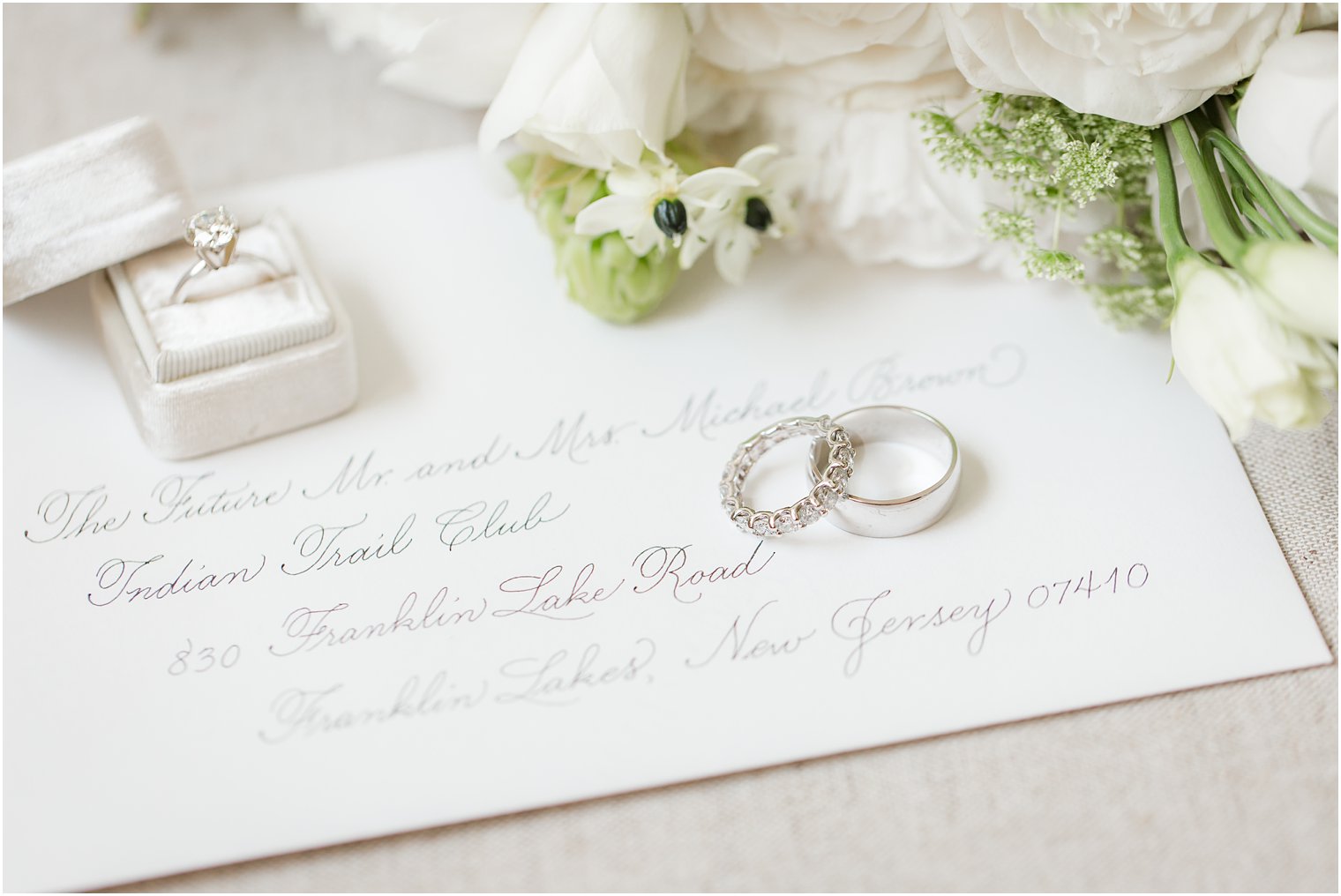 Custom envelope used for photo of rings on wedding day