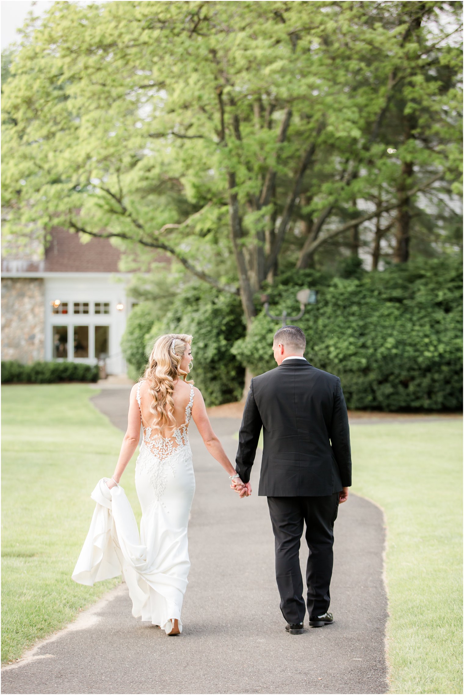 bride and groom walking to reception at Indian Trail Club in Franklin Lakes NJ