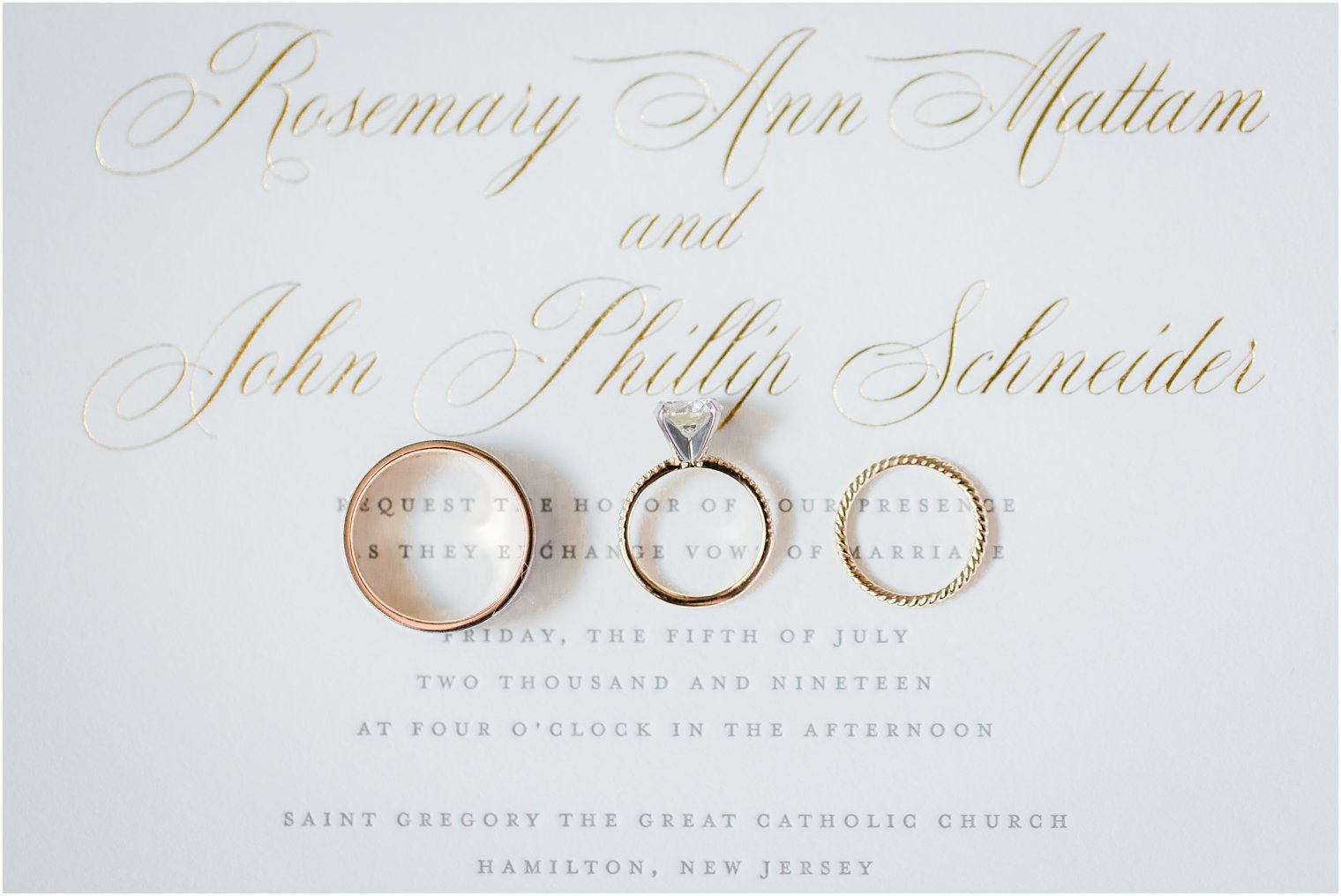 Wedding rings on letterpress invitation 