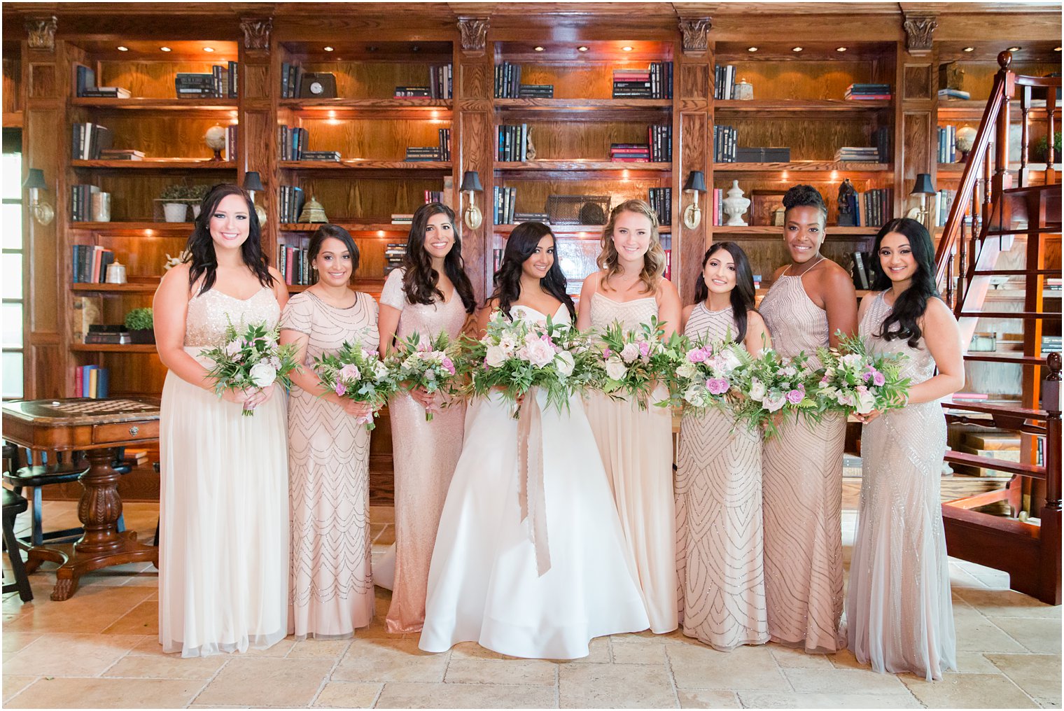 Bridesmaids in mismatched dresses with bouquets by Petal Pushers Magnolia