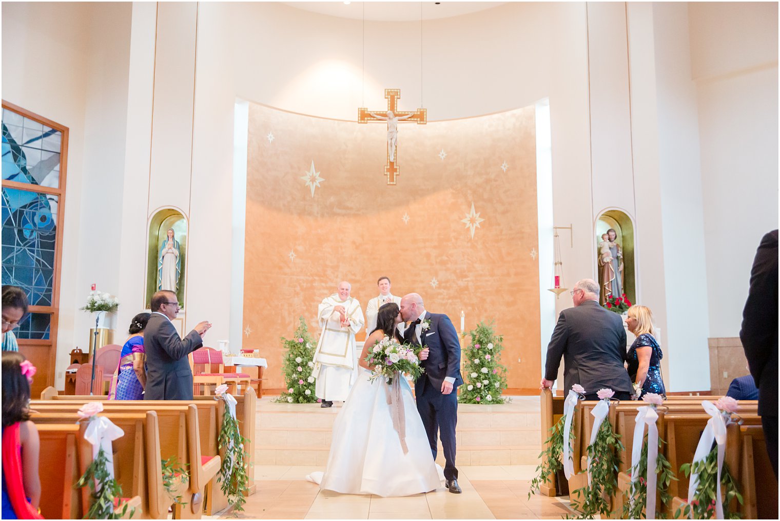 First kiss at Wedding ceremony at St. Gregory the Great in Hamilton, NJ