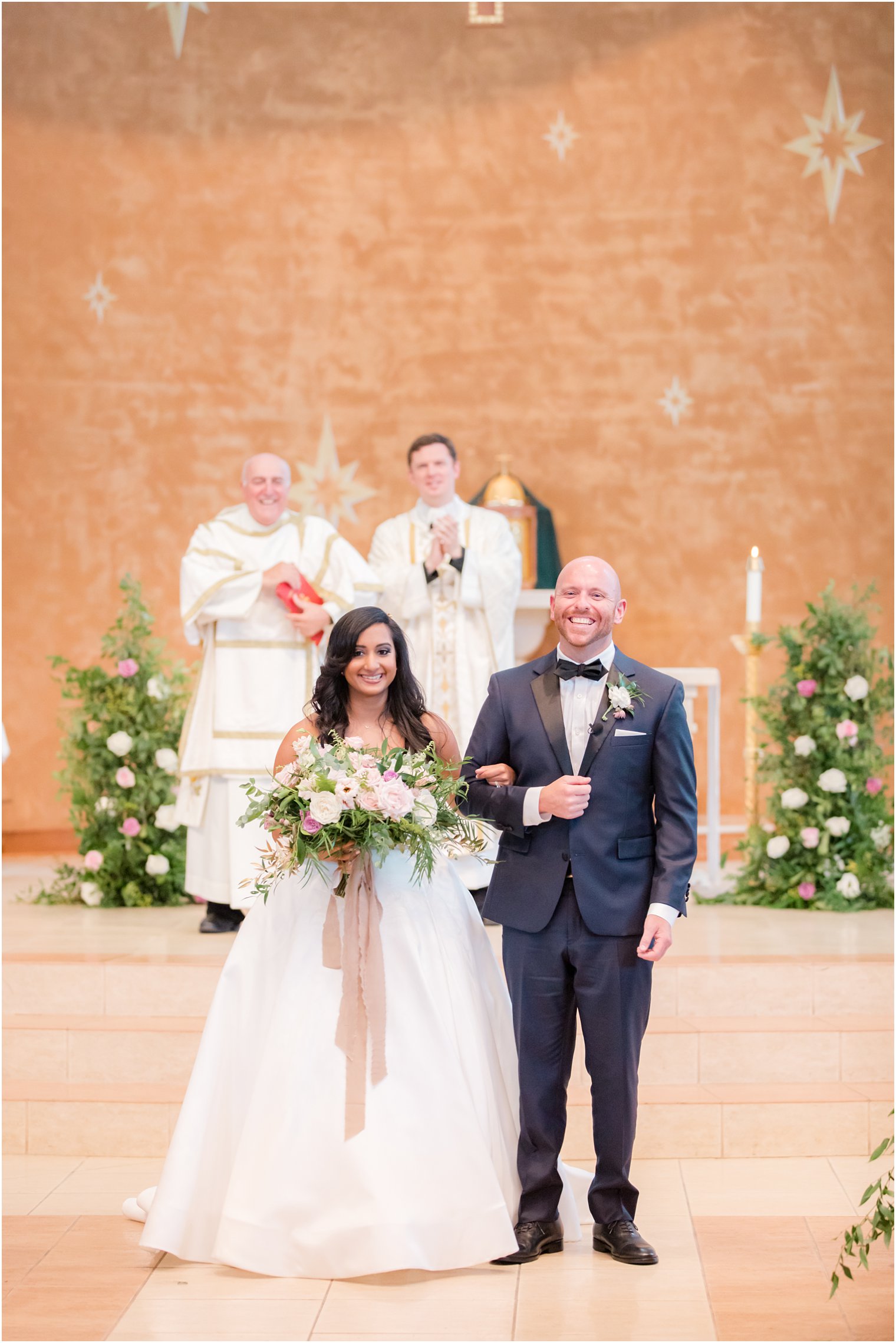 Bride and groom walking down the aisle during Wedding ceremony at St. Gregory the Great in Hamilton, NJ