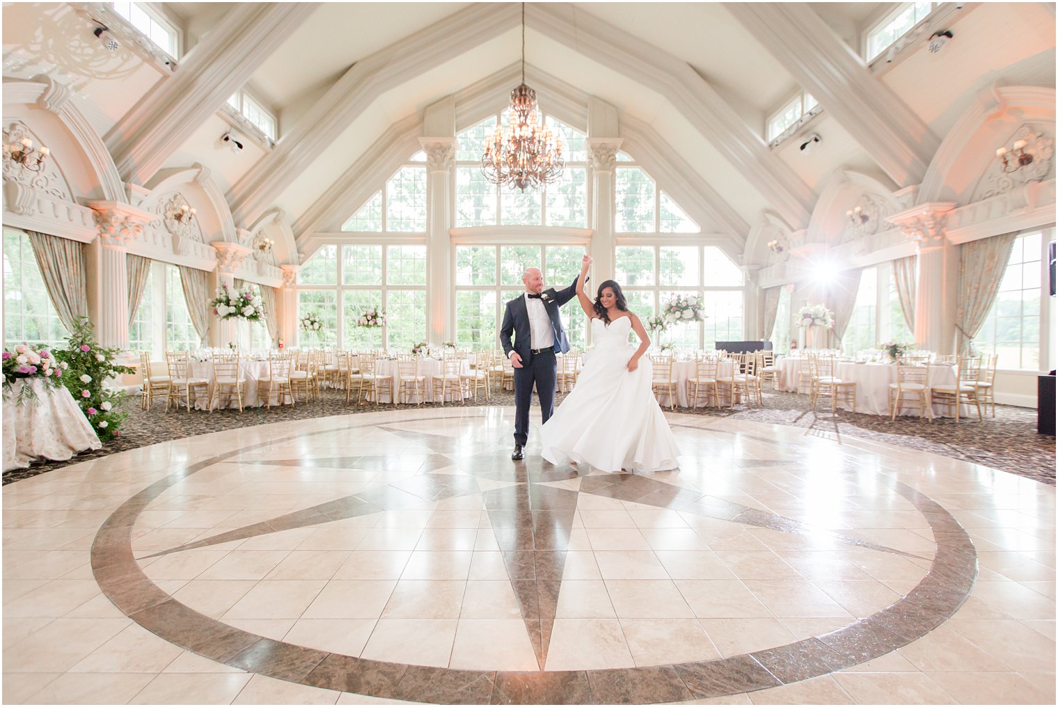 Groom twirling his bride at reception at The Ashford Estate