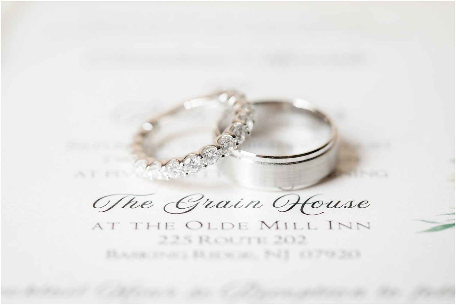 Wedding bands on invitation for wedding at The Grain House at the Olde Mill Inn