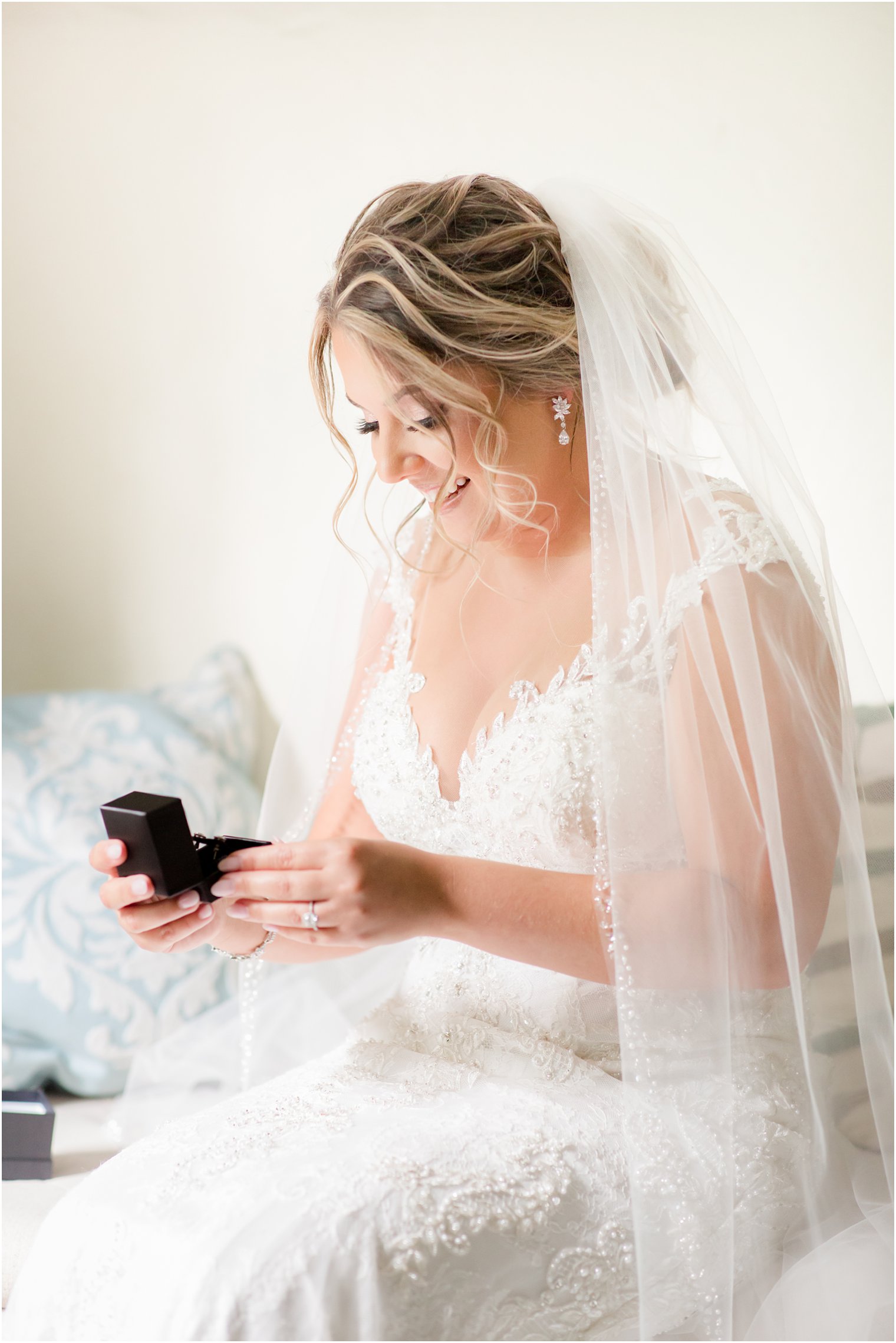 Bride opening gift from her groom