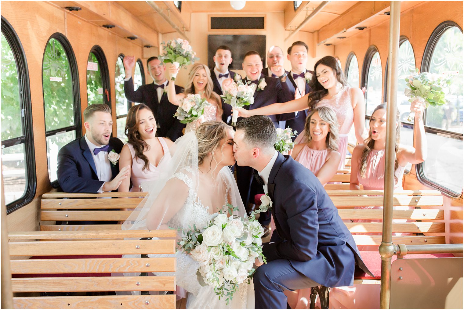 Fun bridal party photo in trolley 