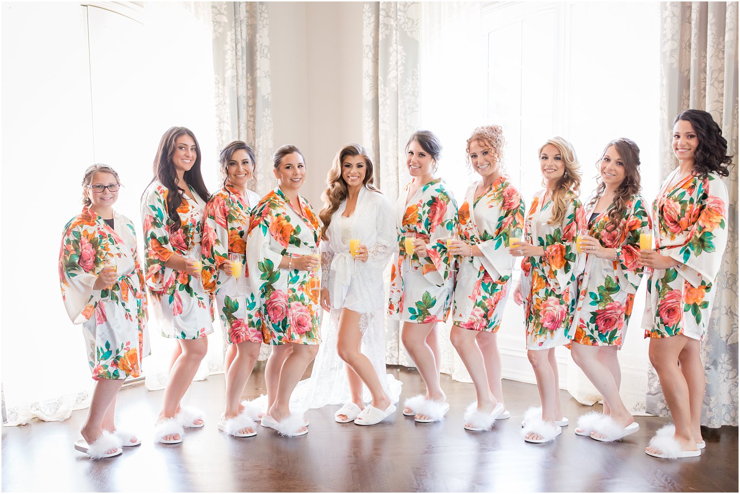 Bridesmaids wearing floral robes
