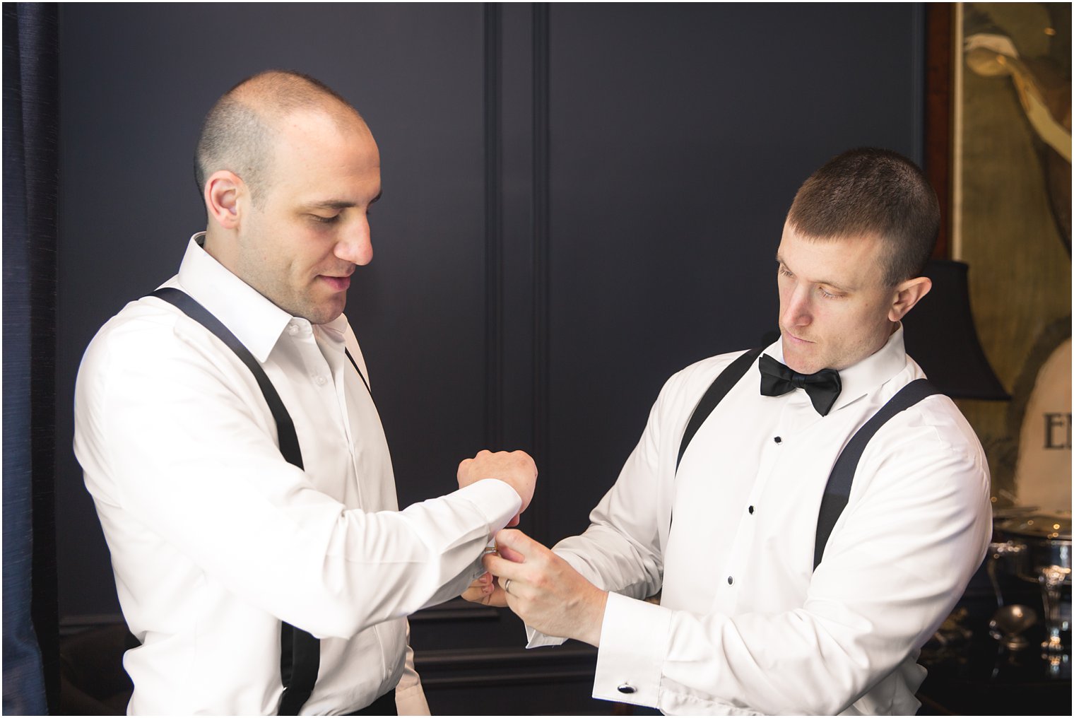 Groom and best man getting ready at Park Chateau Estate