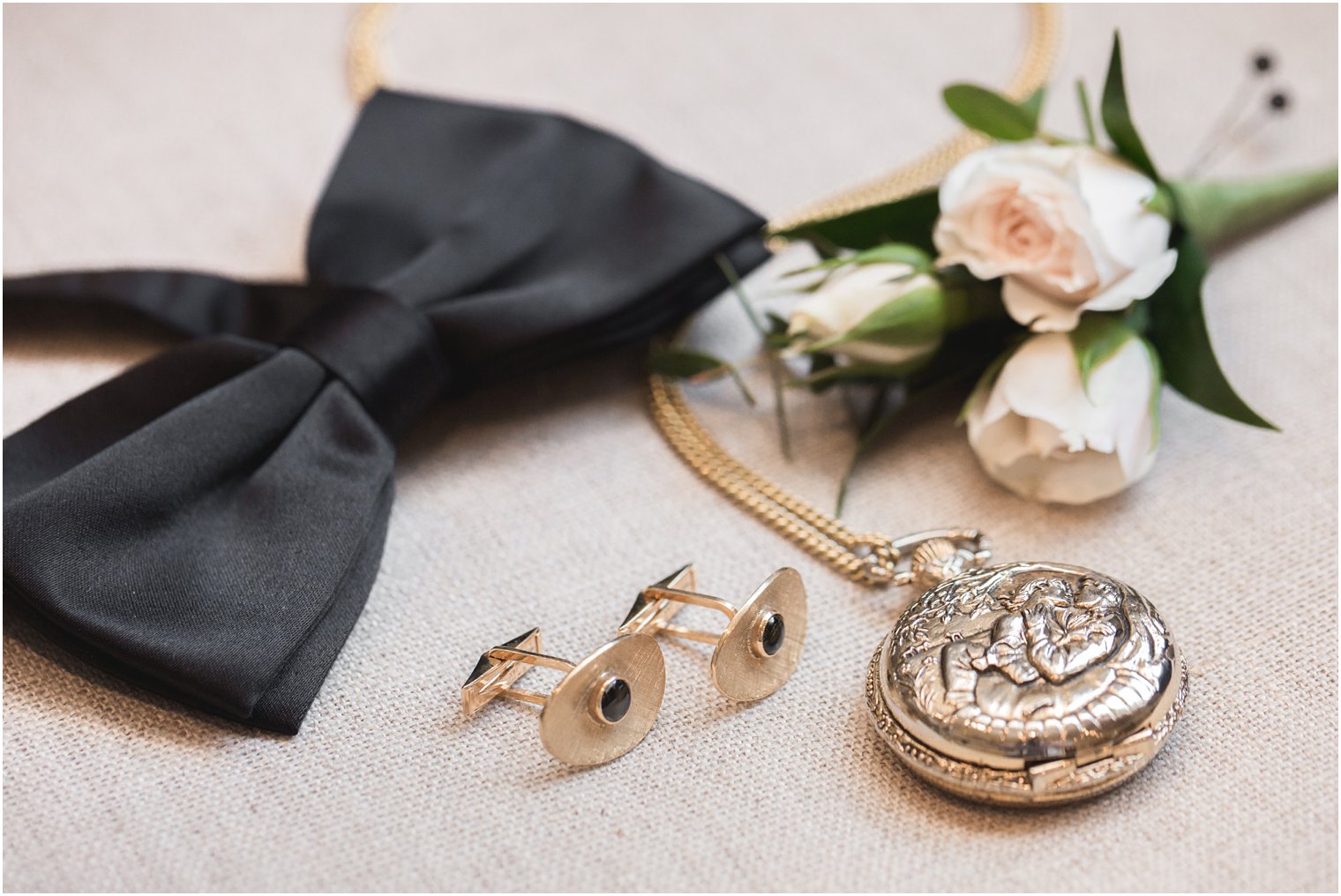 Groom's pocket watch and bowtie at Park Chateau Estate