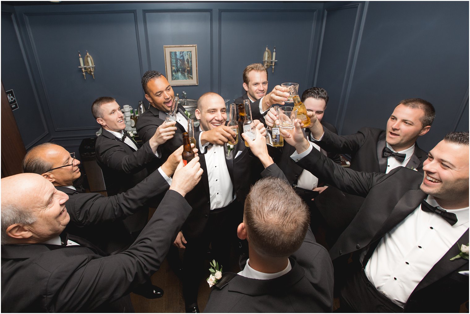 Groom toasting with groomsmen at Park Chateau Estate