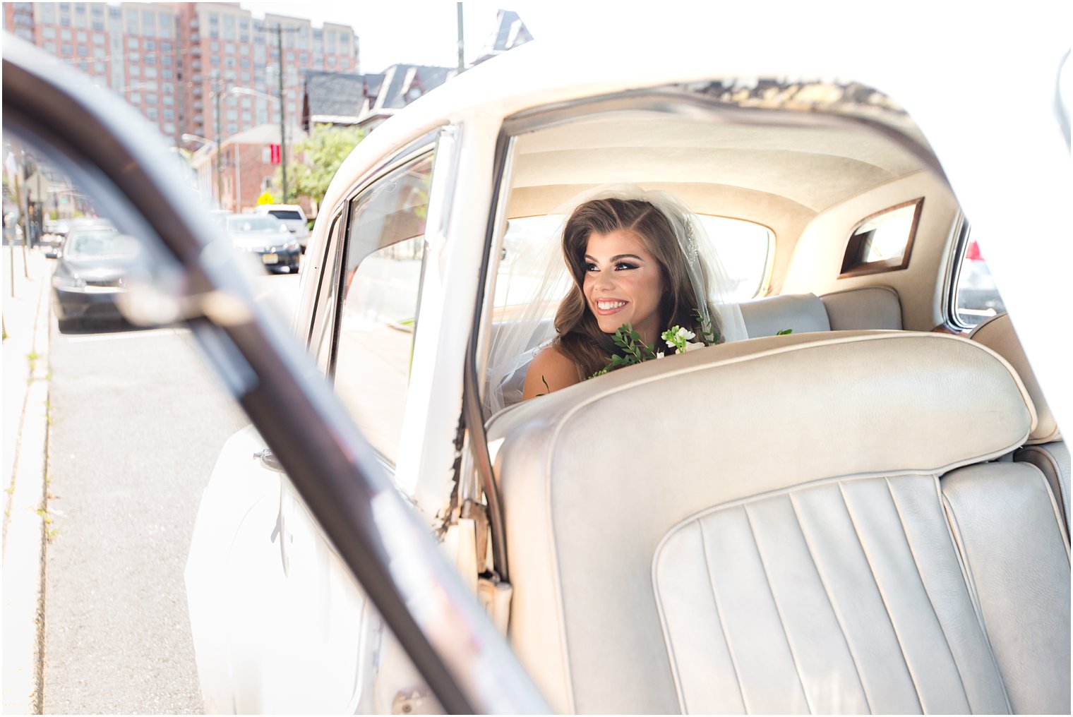 Bride arriving in Rolls Royce to wedding ceremony at St. Peter the Apostle at Park Chateau Estate