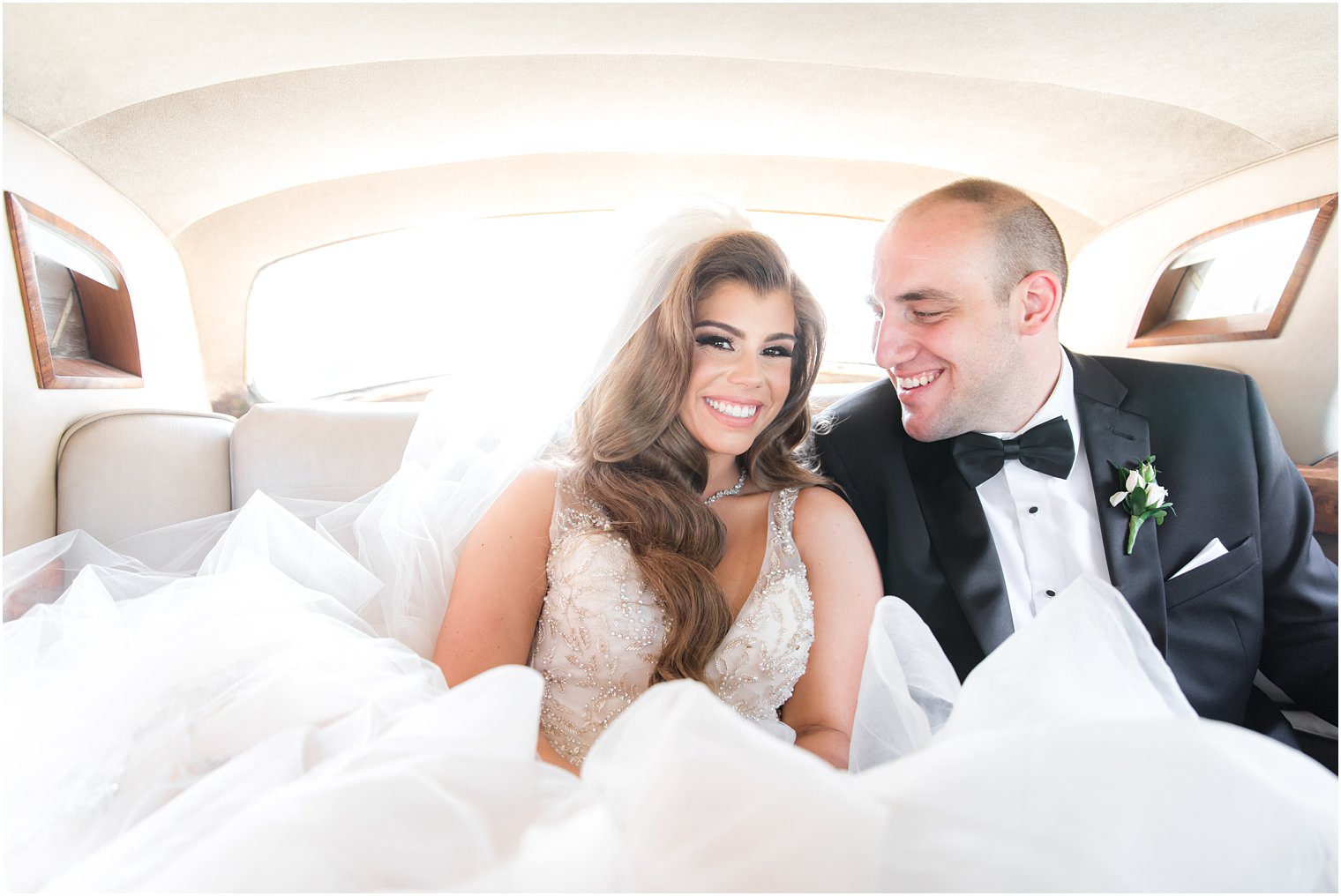 Bride and groom in Rolls Royce