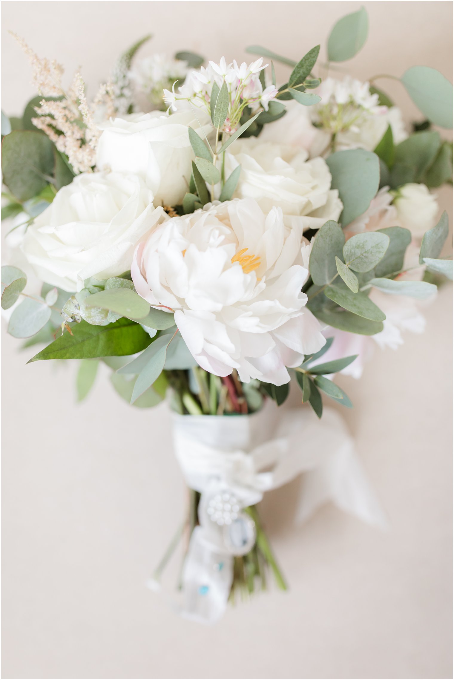 Ivory and green wedding bouquet by Faye and Renee photographed by NJ wedding photographer Idalia Photography