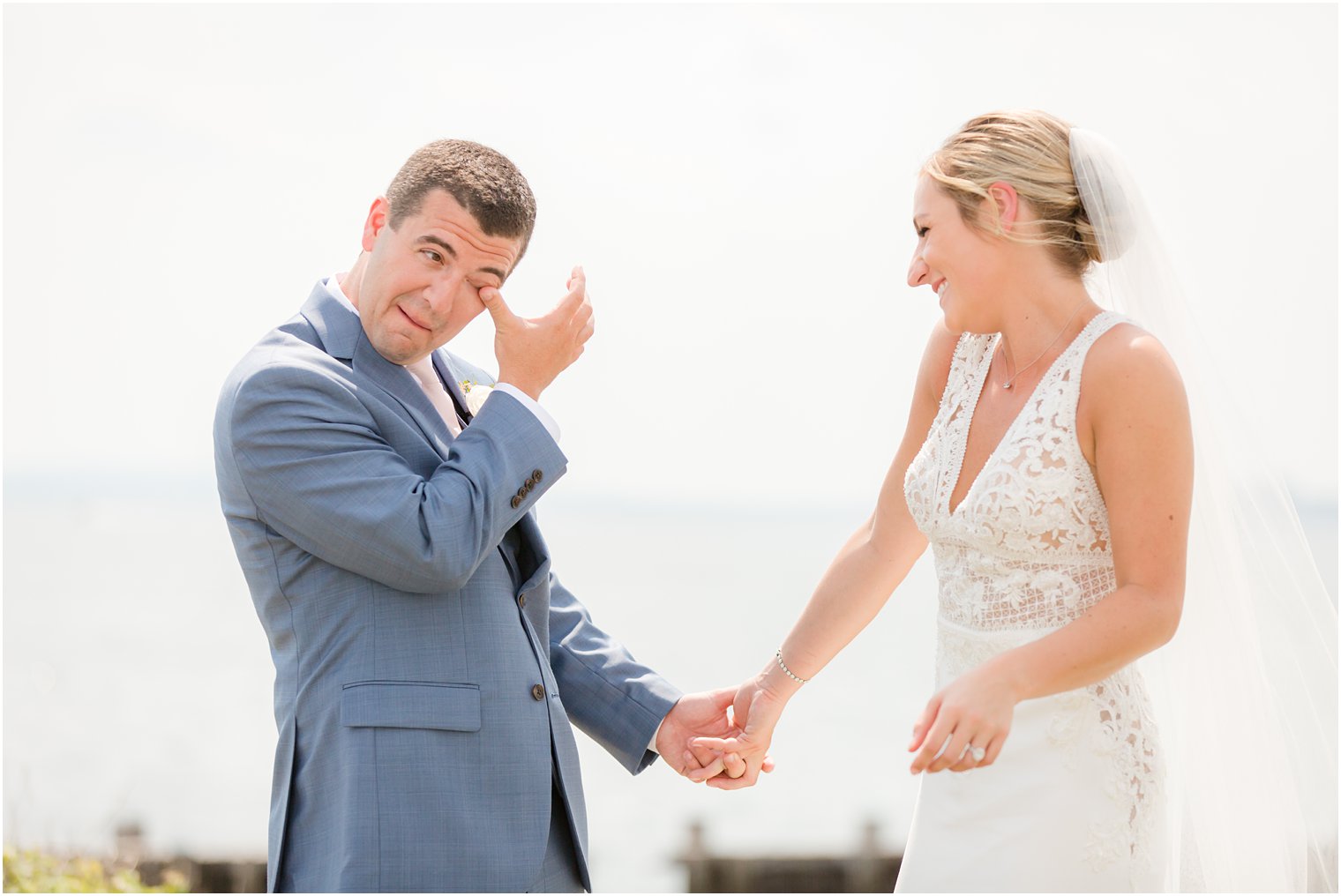 groom's reaction to Sandy Hook Chapel wedding day photographed by Idalia Photography