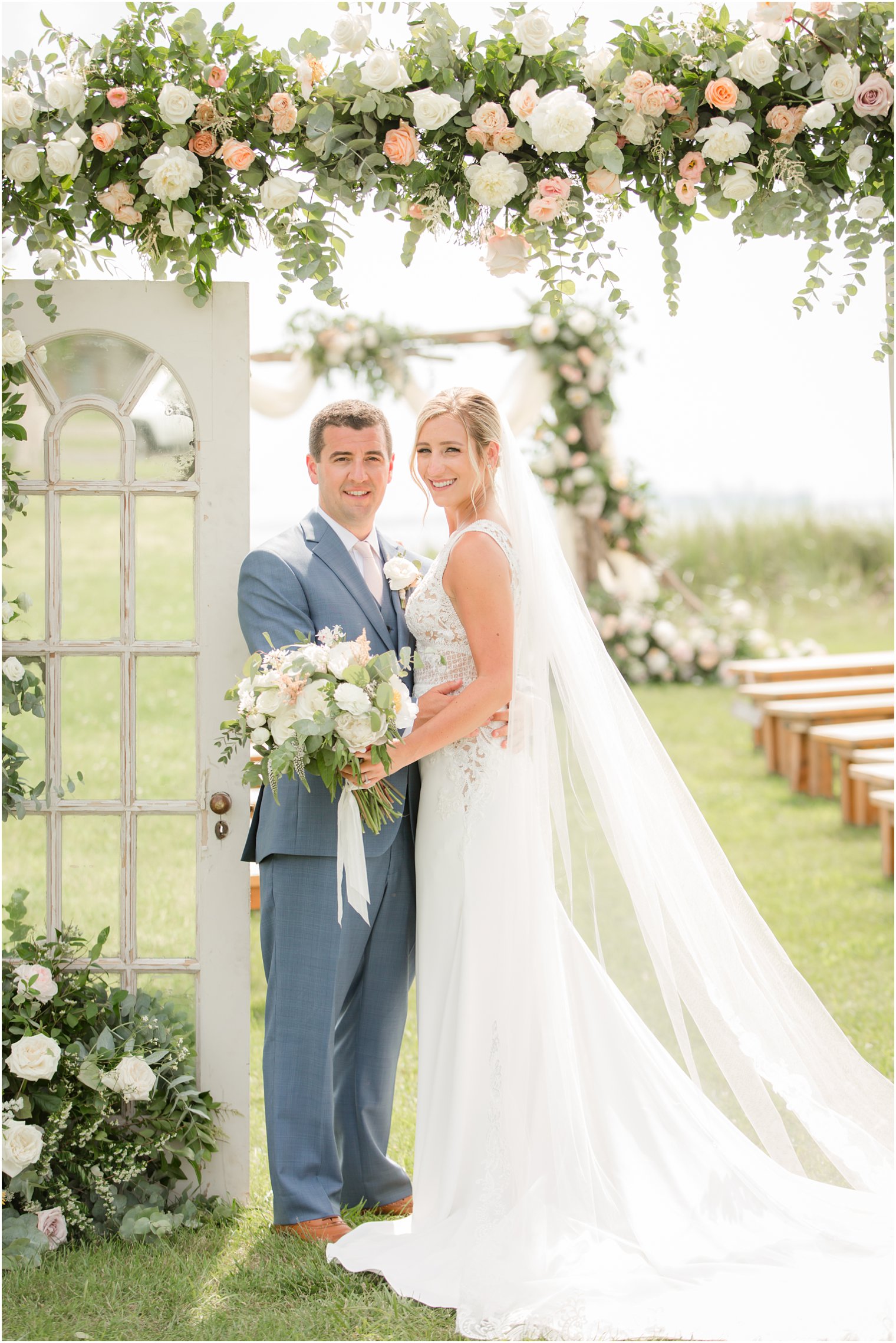 peach and ivory floral arch by Faye and Renee photographed by New Jersey wedding photographer Idalia Photography