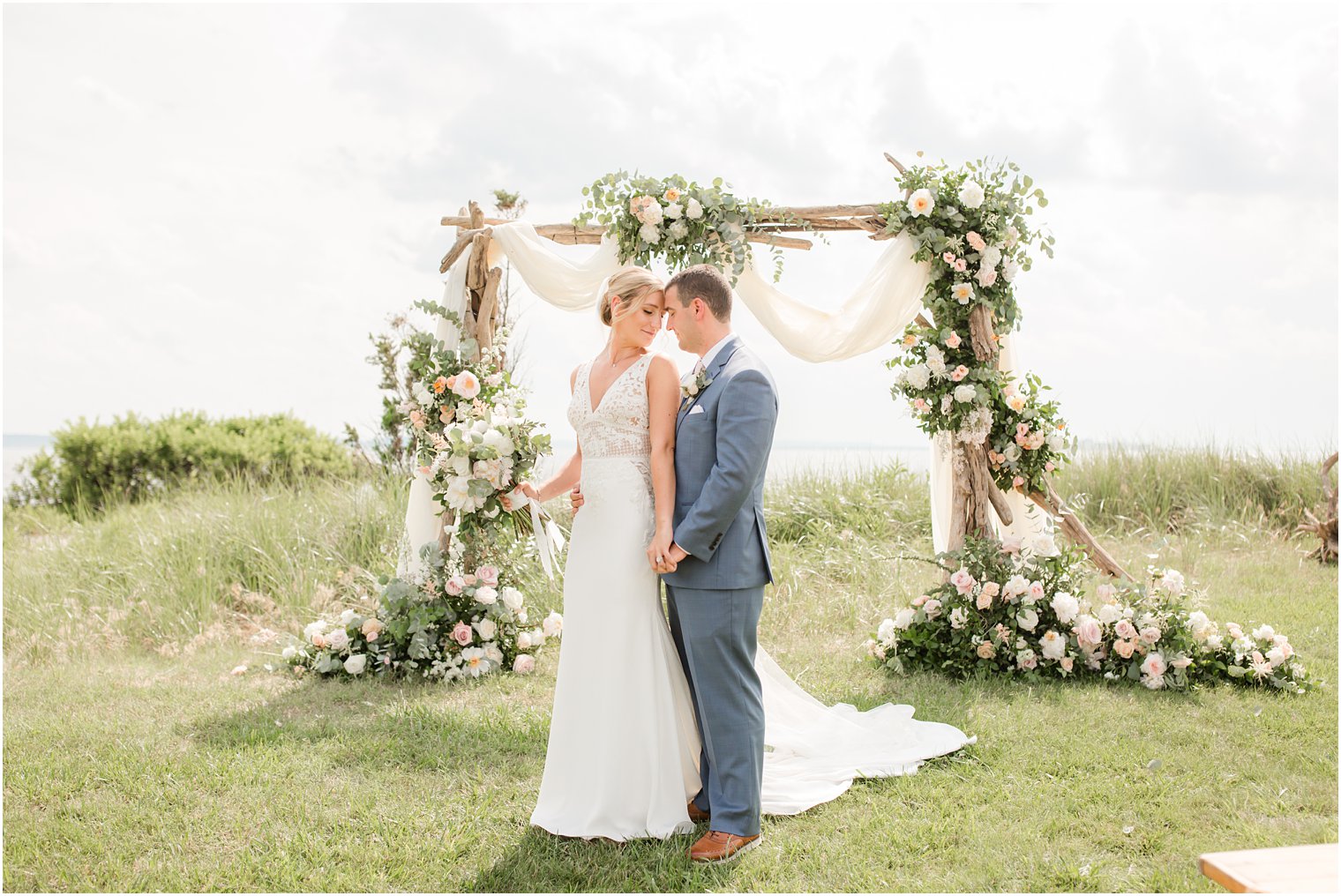 floral arches for Sandy Hook Chapel wedding ceremony photographed by Idalia Photography
