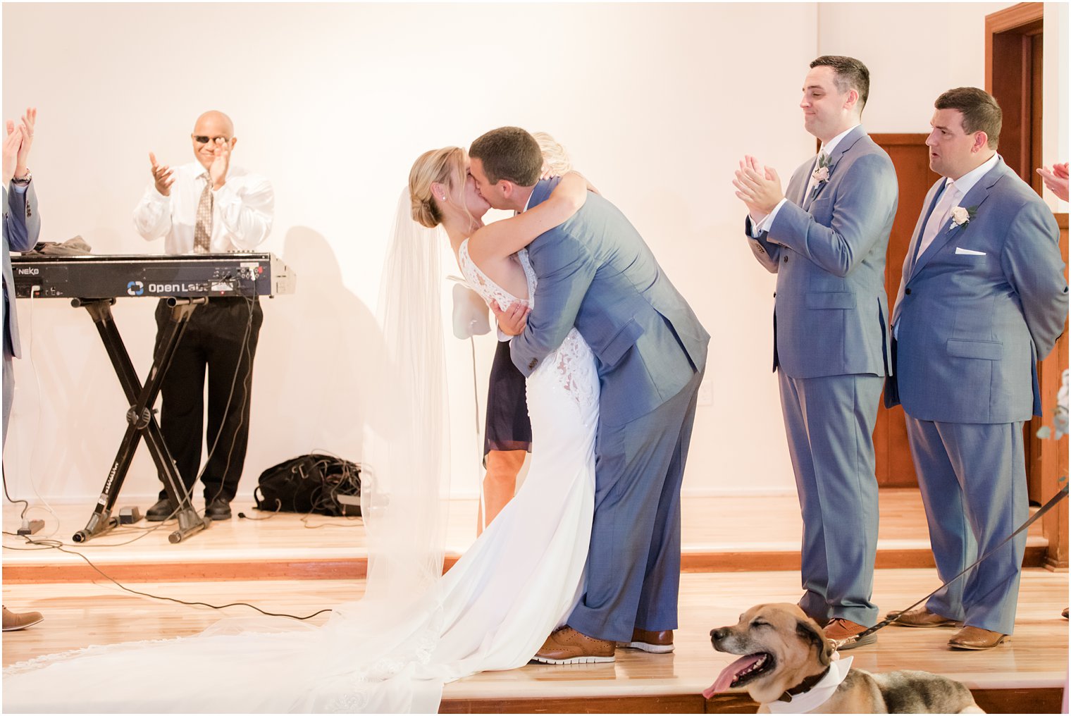 first kiss at Sandy Hook Chapel wedding by Idalia Photography