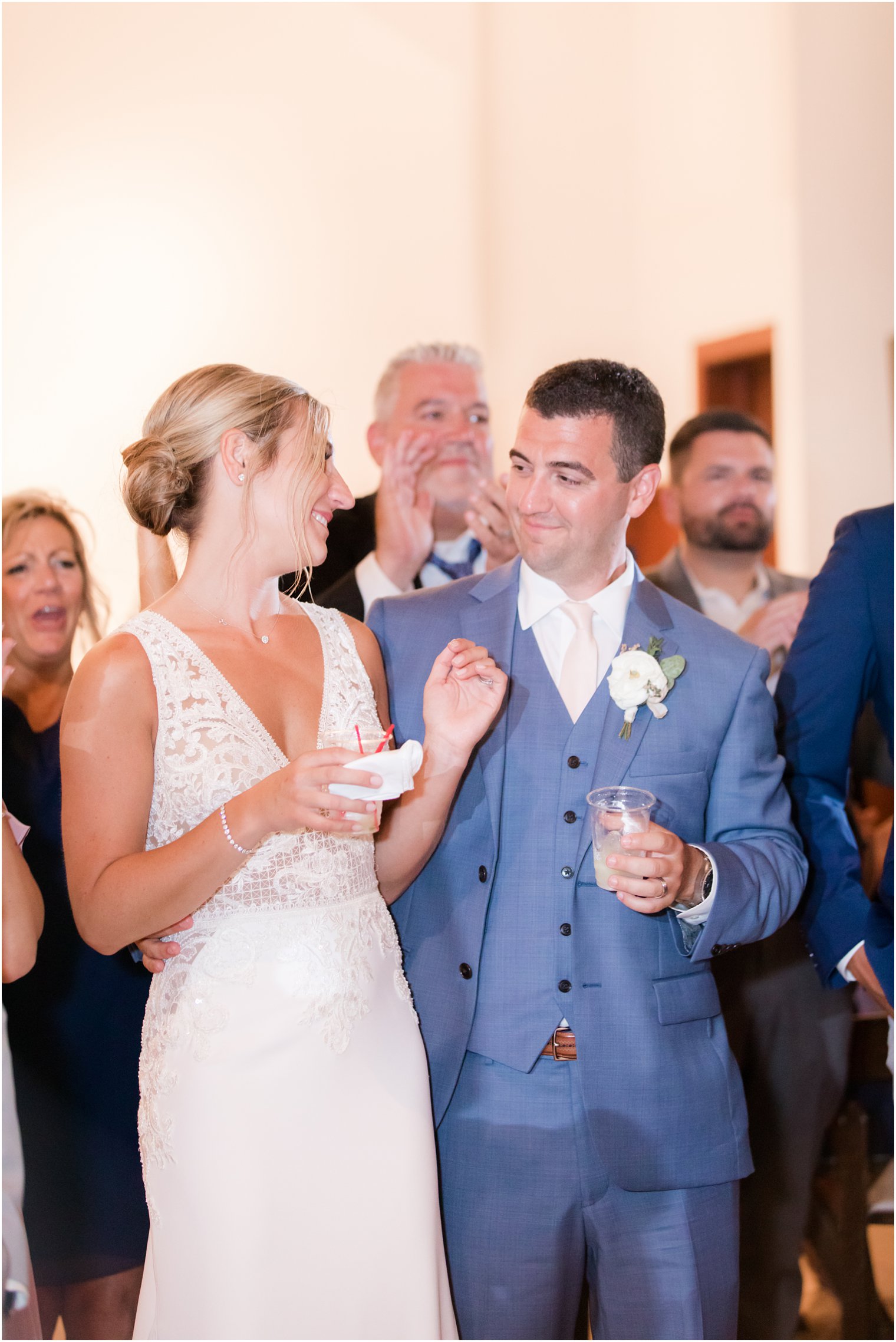 bride and groom toast during reception at Sandy Hook Chapel wedding day photographed by Idalia Photography