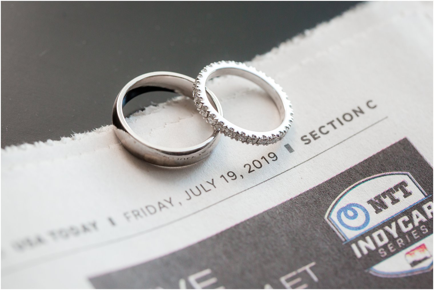 Wedding bands on newspaper | Stone House at Stirling Ridge Wedding Photography by Idalia Photography