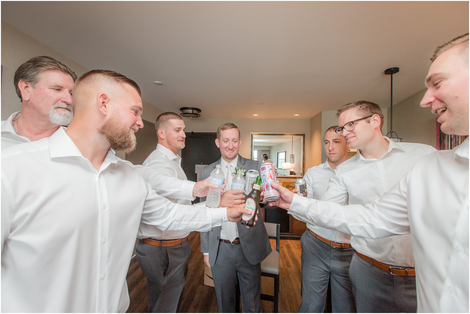 Groom toasting with groomsmen on wedding morning | Stone House at Stirling Ridge Wedding Photography by Idalia Photography