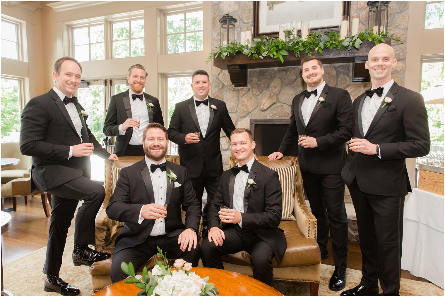 Groom and groomsmen posing for portraits at Indian Trail Club