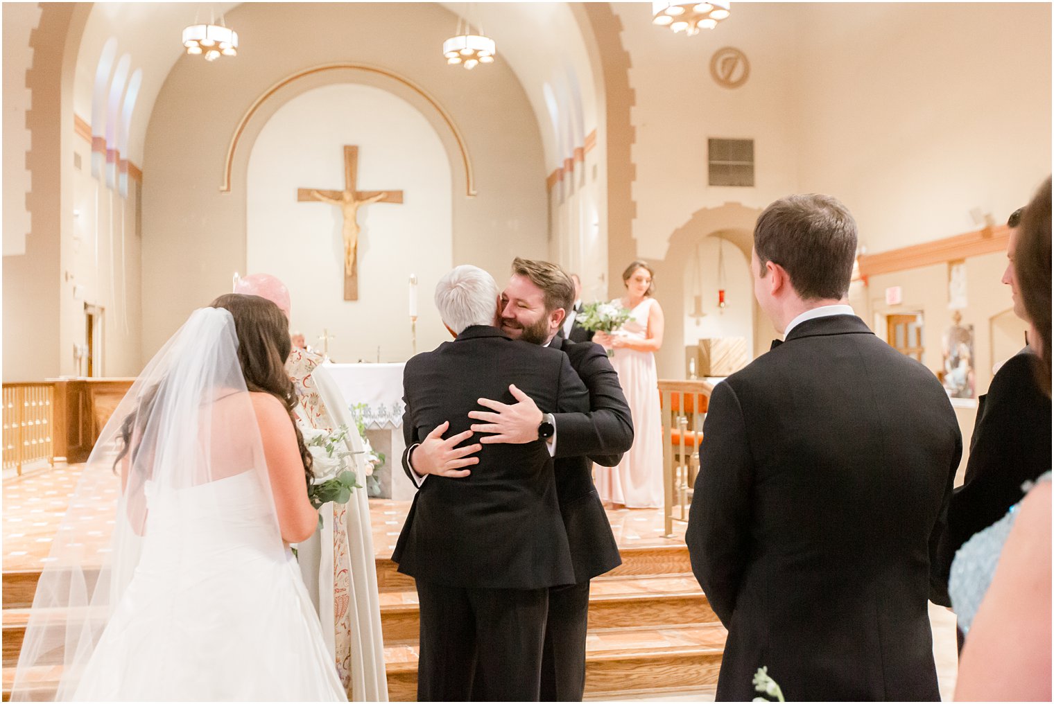 Father of the bride giving away his daughter at the altar