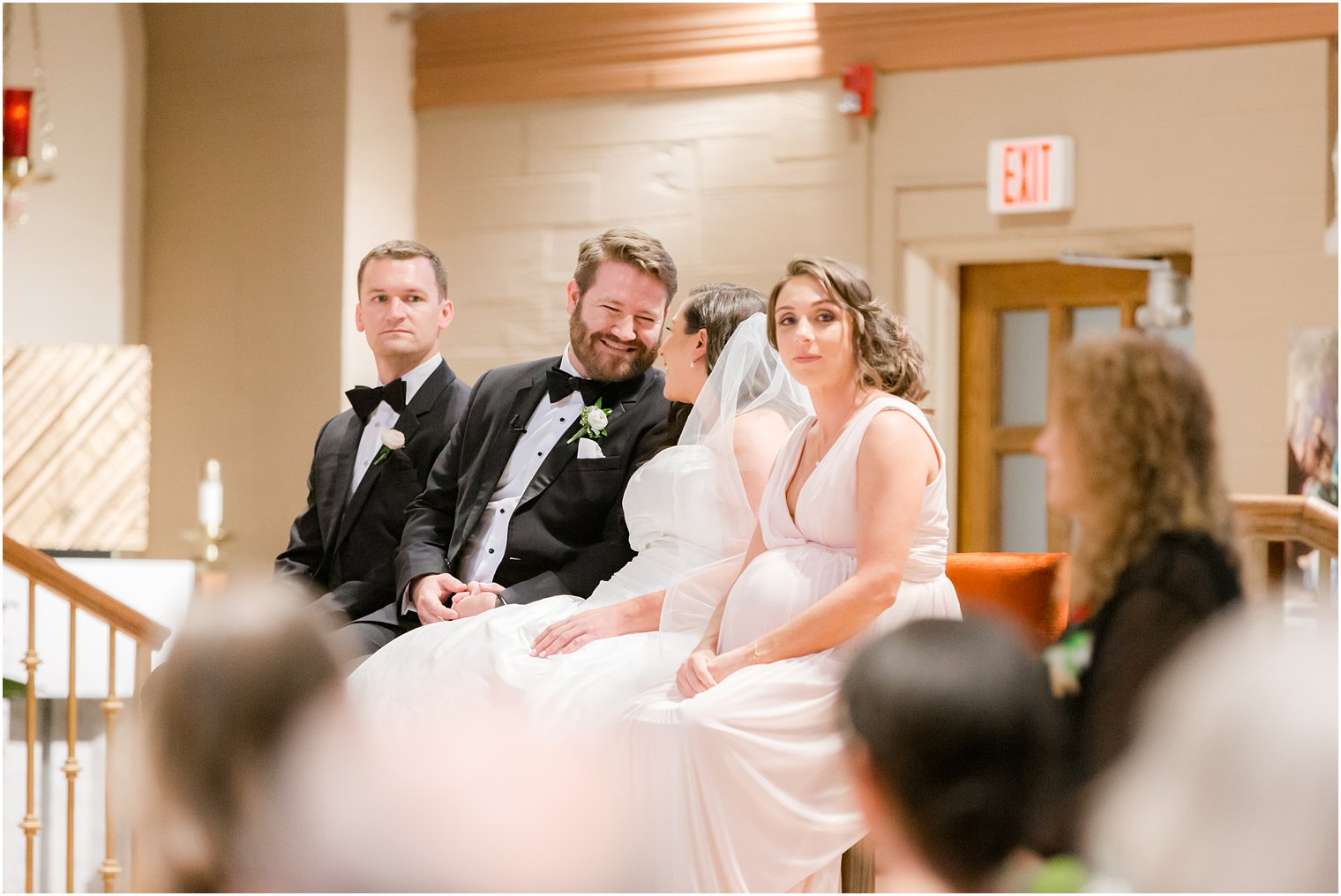 Bride and groom smiling during wedding ceremony at St. Luke's Church in Ho-Ho-Kus