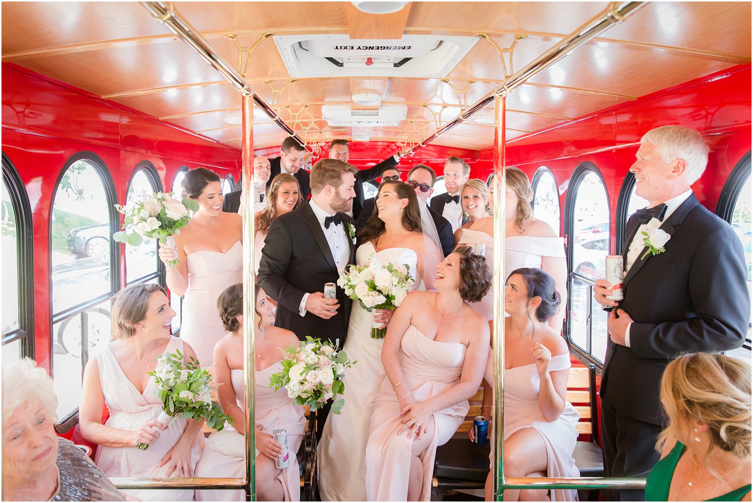 Bride, groom, and wedding party in Long Branch Trolley 