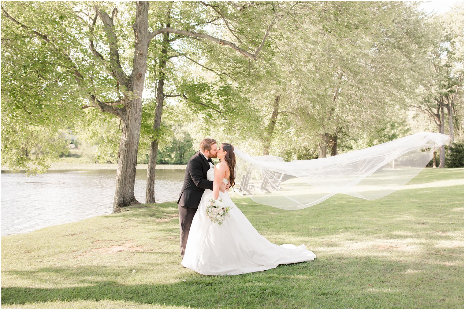 Bride and groom posing for photos at Indian Trail Club 