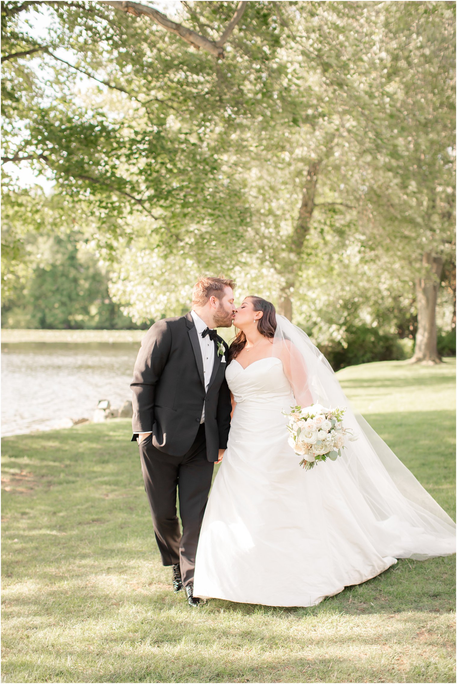 Bride and groom walking during portraits at Indian Trail Club