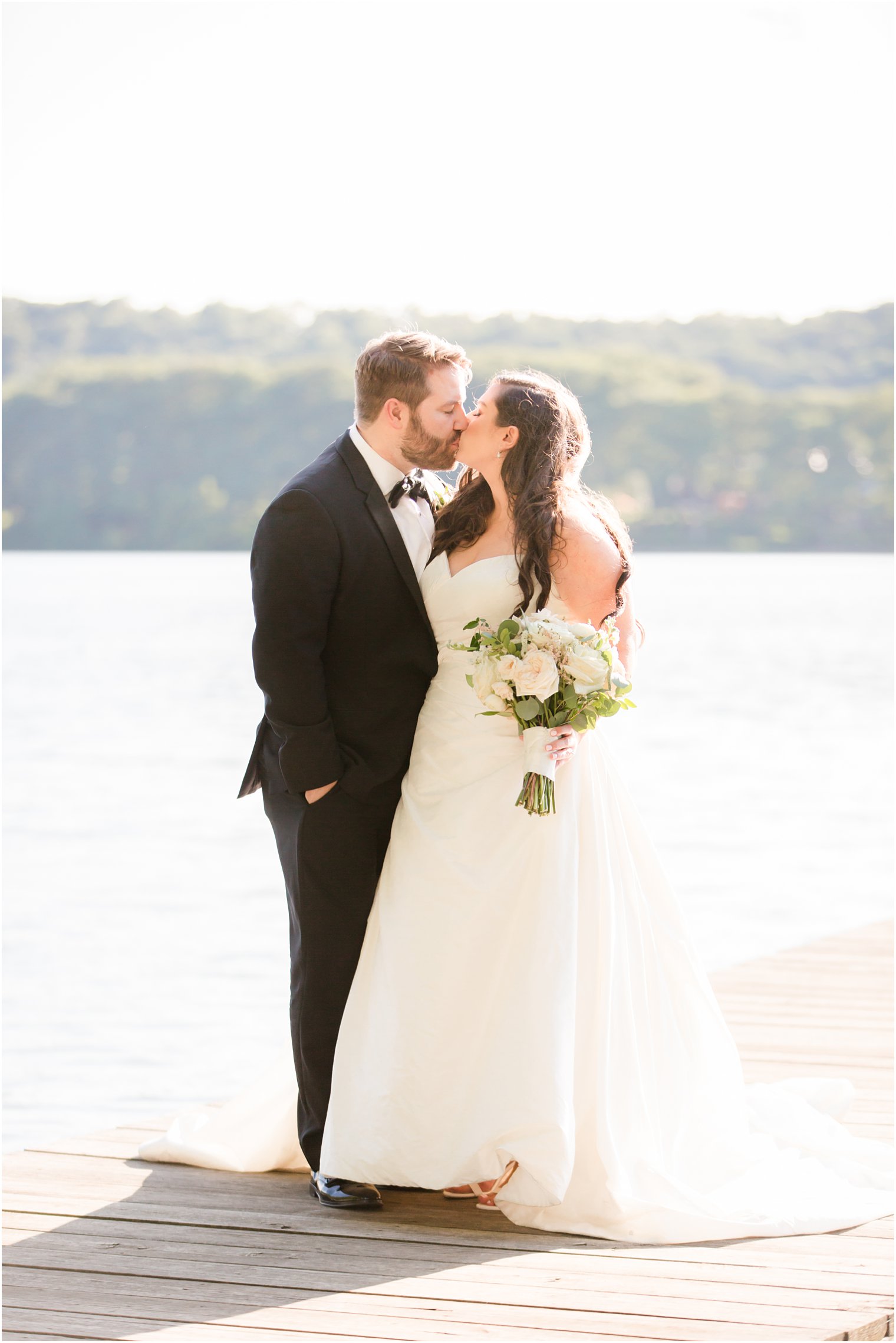 Bride and groom on the dock at Indian Trail Club