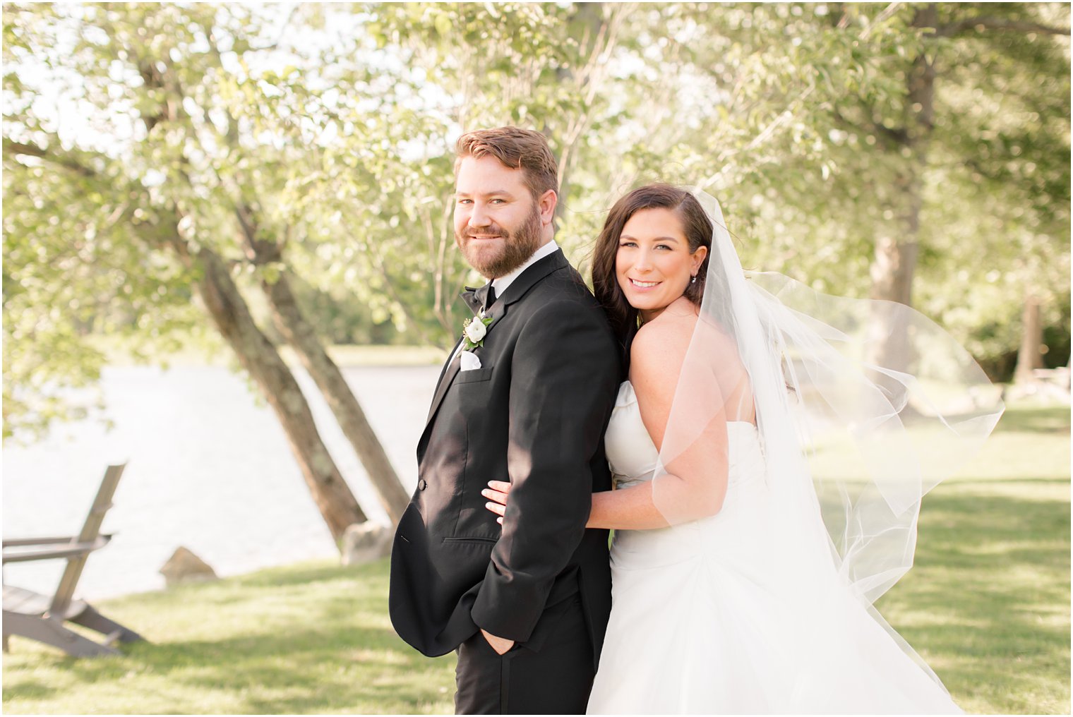 Bride and groom posing for photos at Indian Trail Club