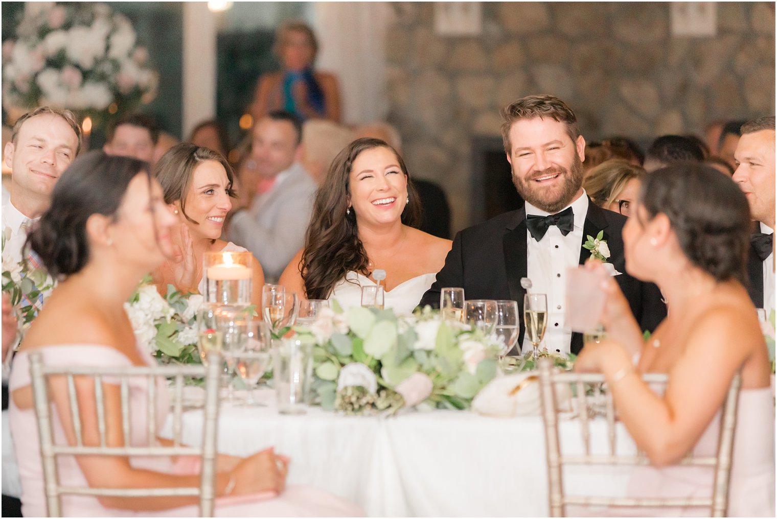 Bride and groom listening to toasts at wedding reception at Indian Trail Club 