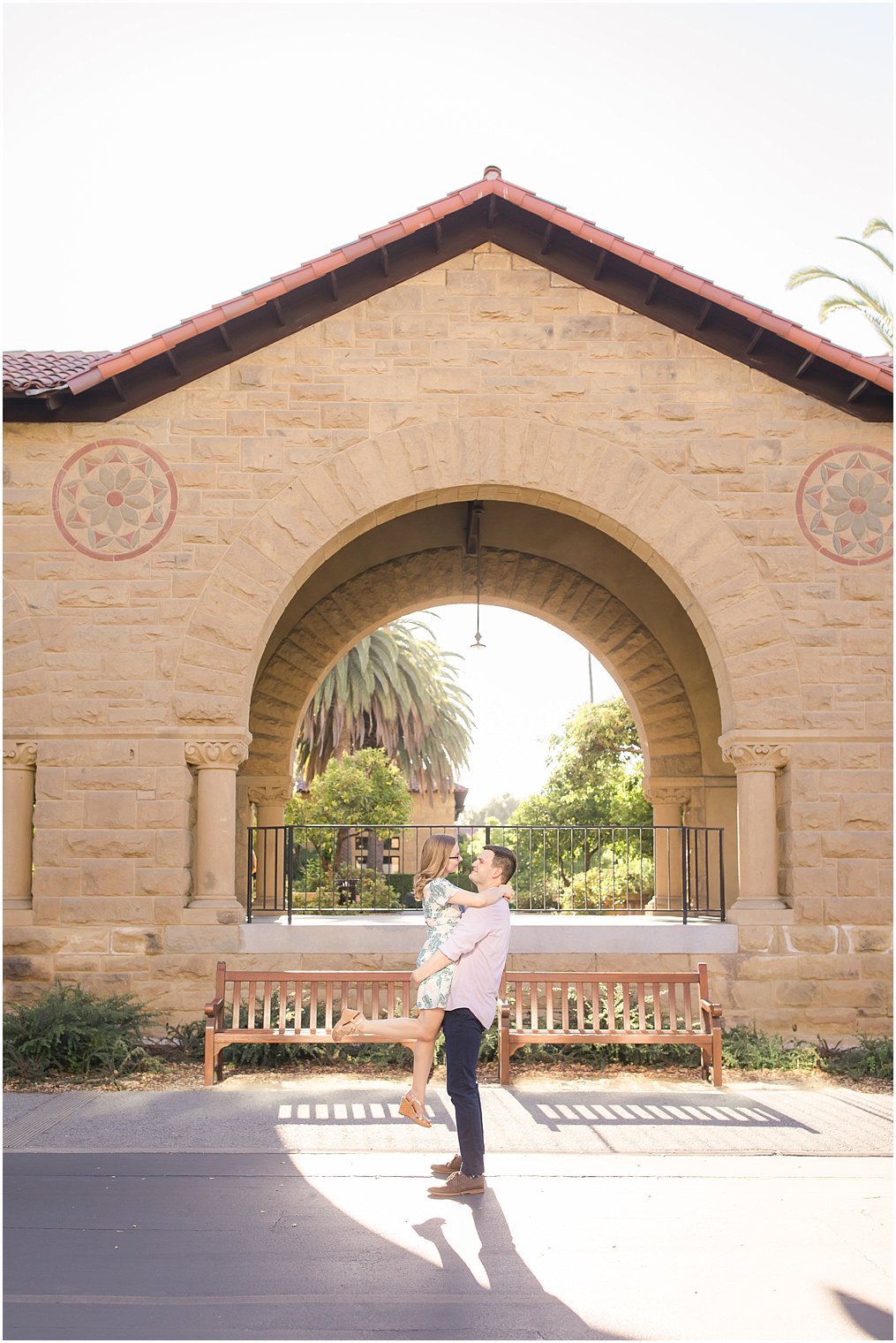 Groom lifting his bride during engagement session at Stanford University