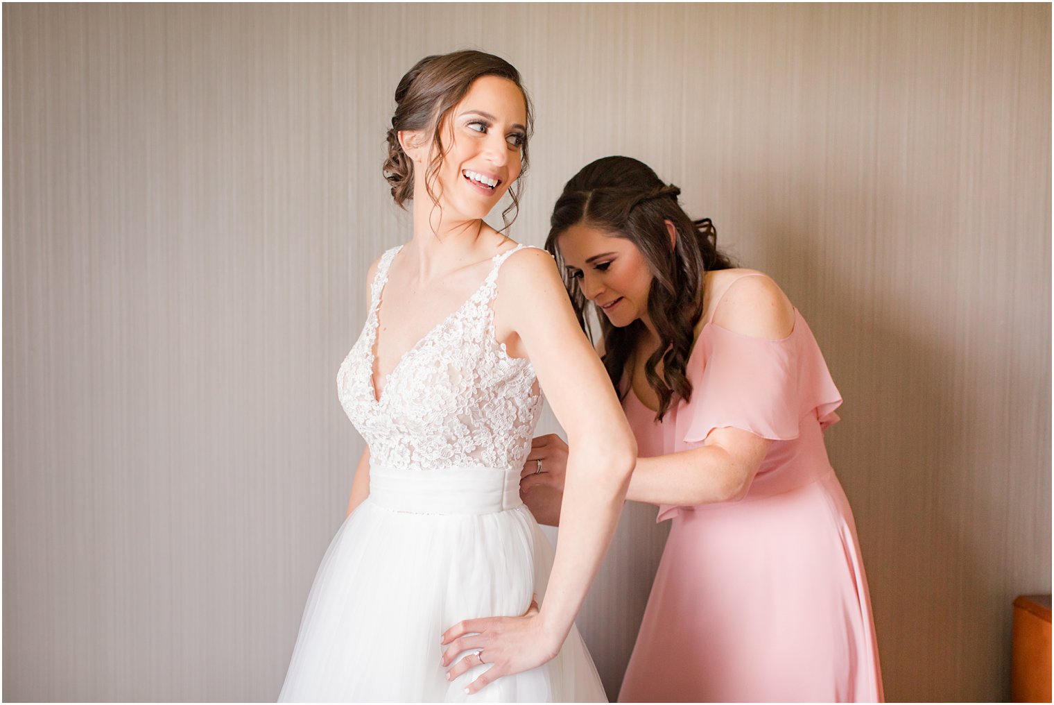 Bride wearing lace dress by Rosa Clara