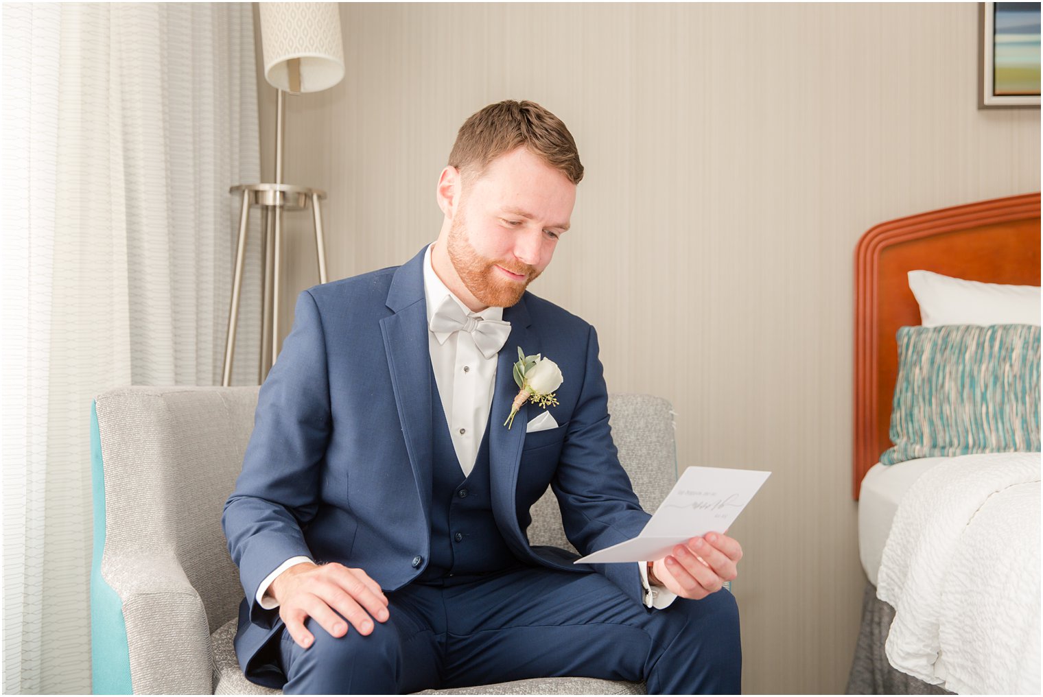 Groom reading letter from his bride