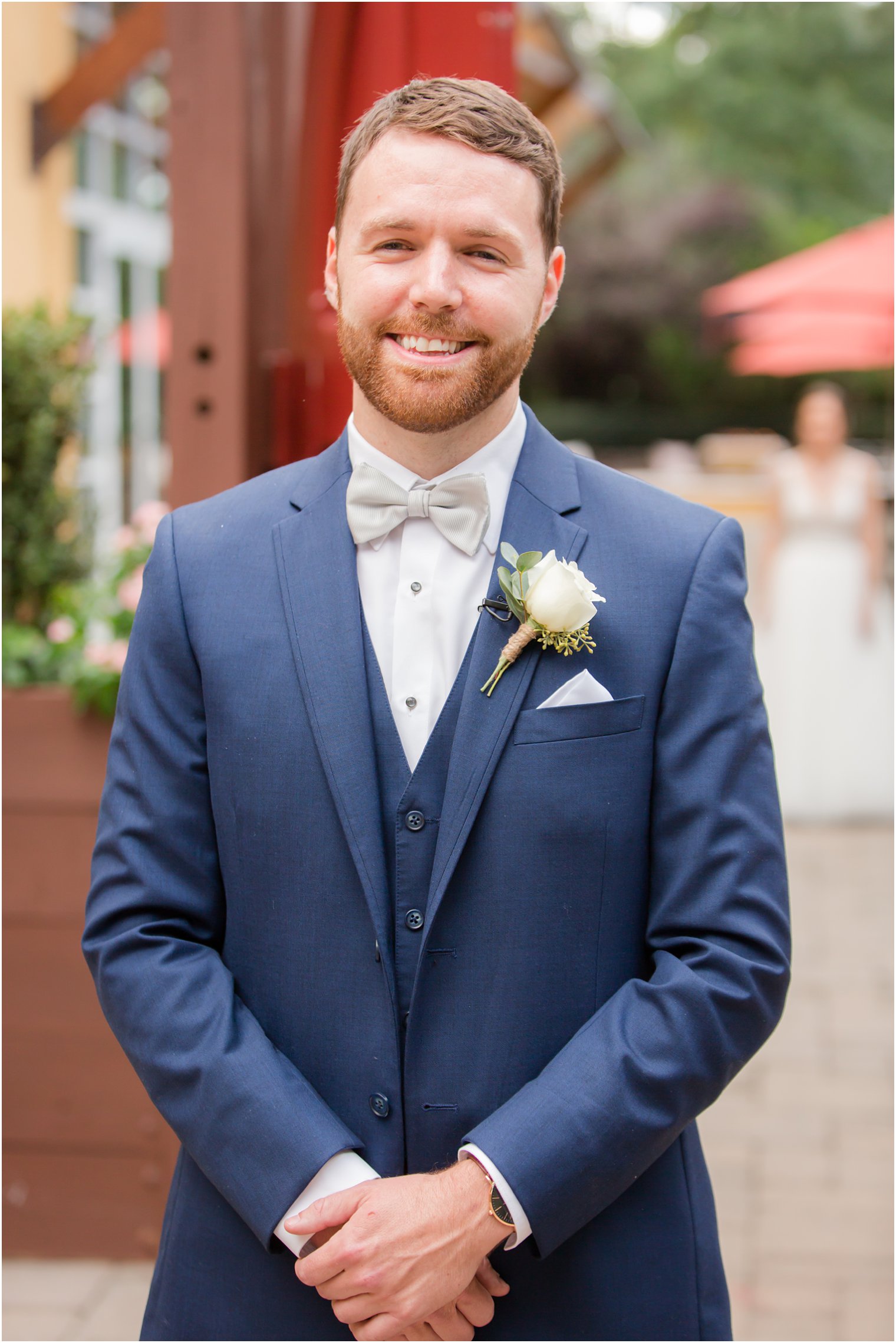 Groom getting ready for first look on wedding day