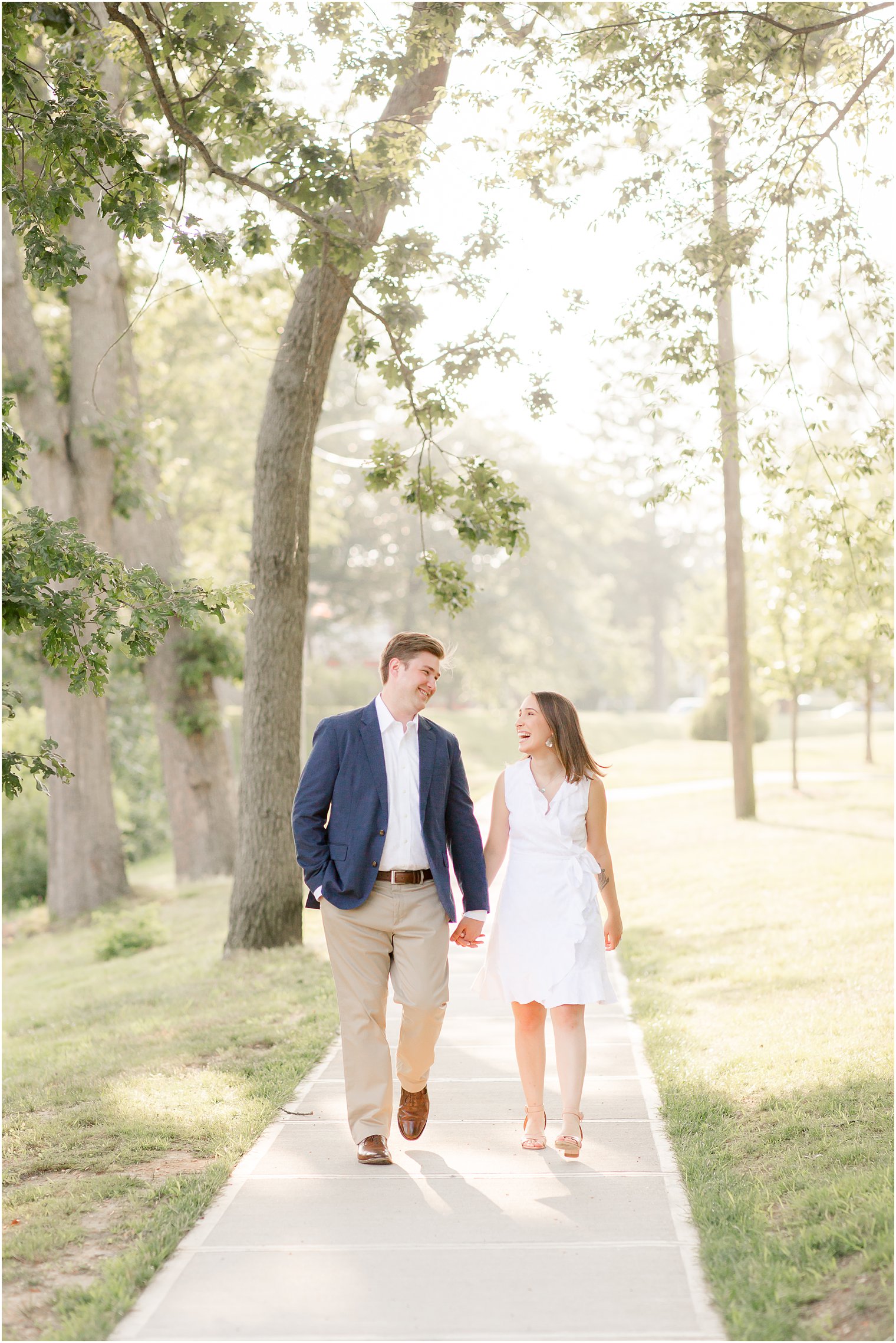 Engaged couple walking during Summer Engagement in Spring Lake, NJ