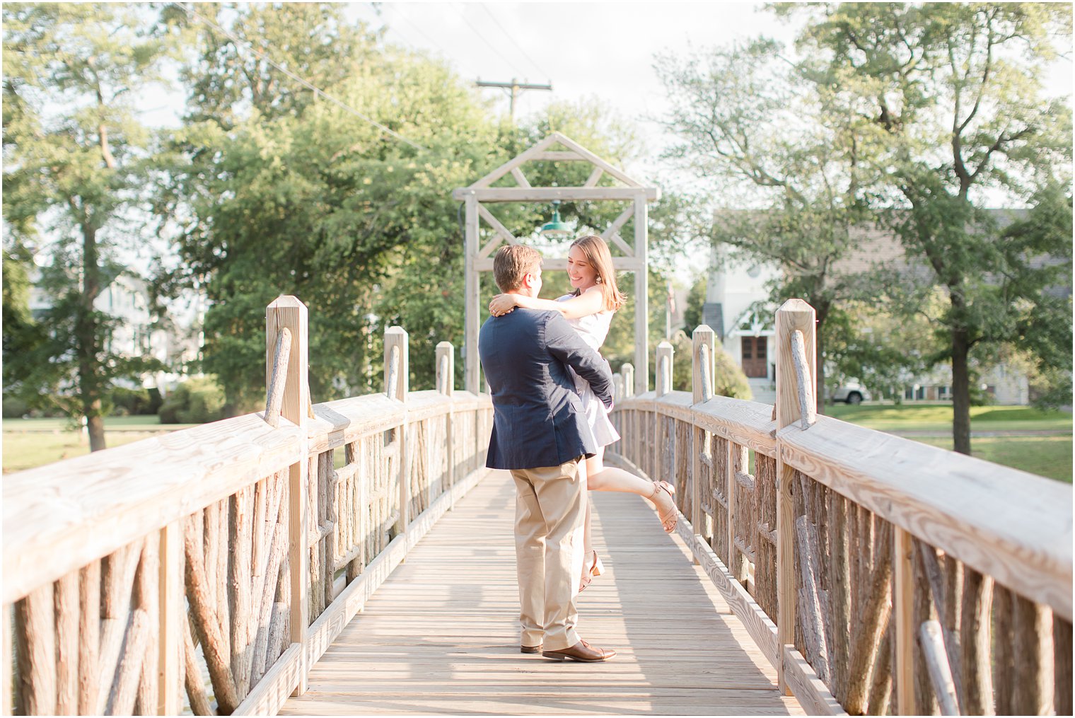 Groom lifting up his bride | Summer Engagement in Spring Lake, NJ