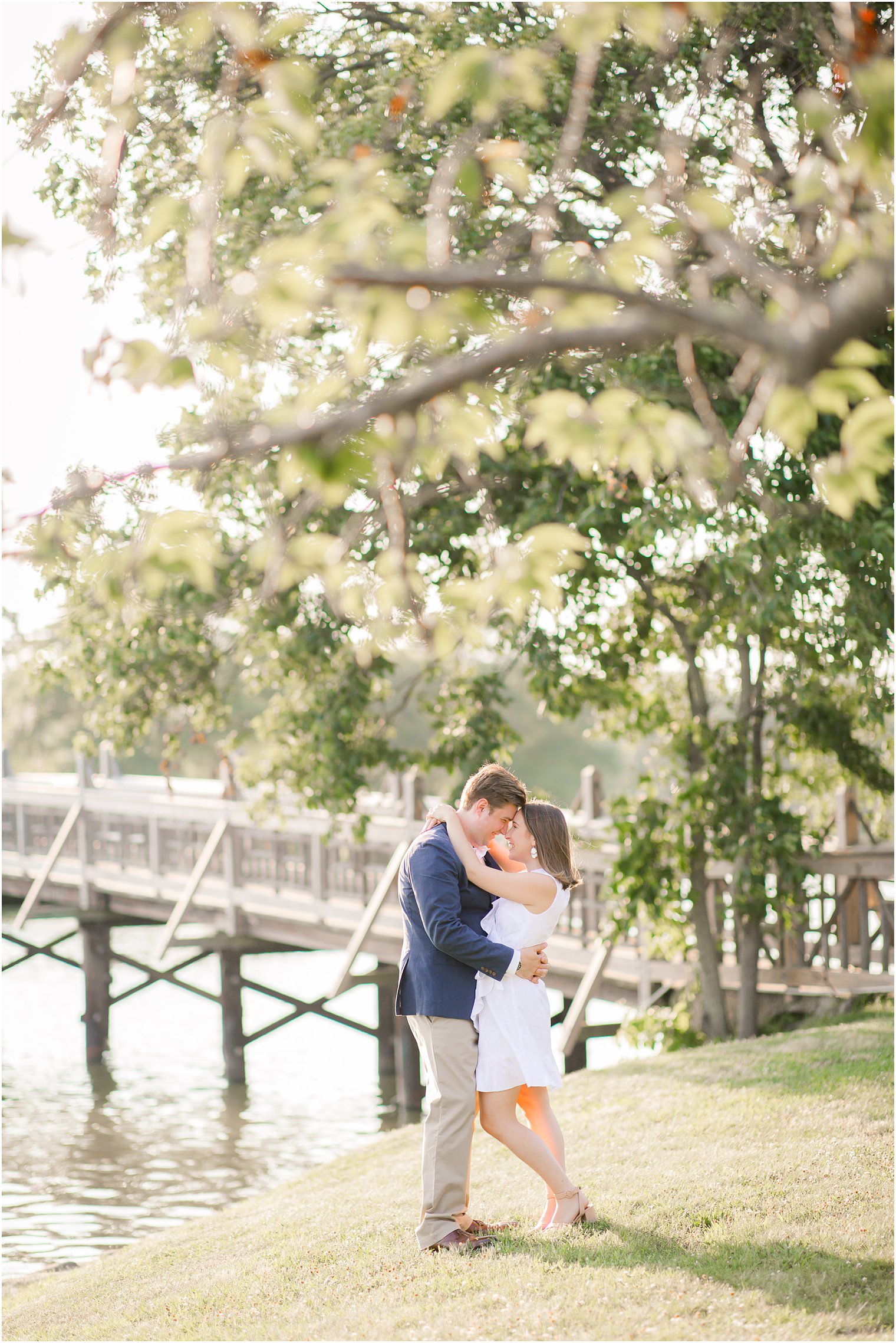 Bride wearing white dress for engagement photos in Spring Lake NJ