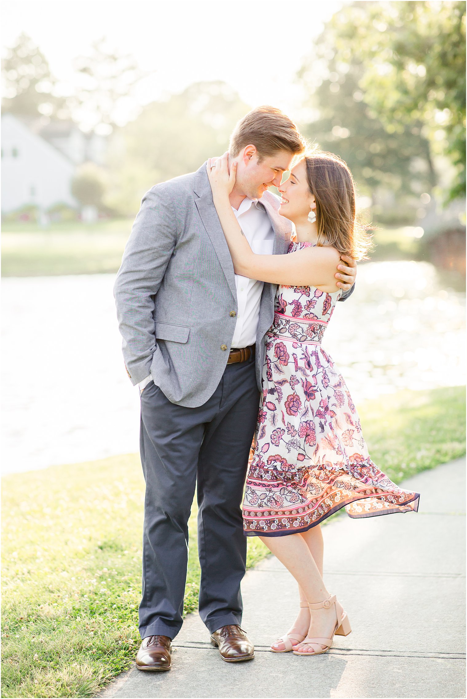 Bride's floral dress blown in the wind during engagement photos