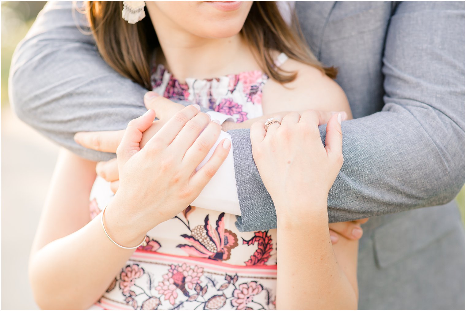 Groom hugging bride in engagement photo