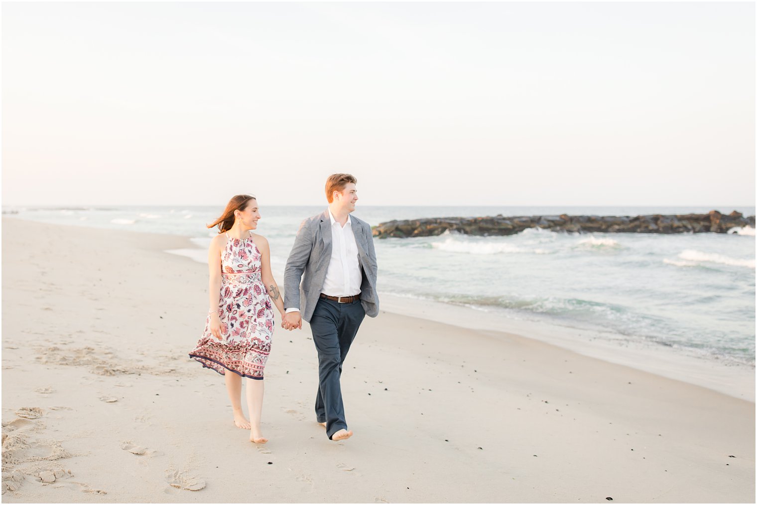 Couple walking on the beach in Spring Lake